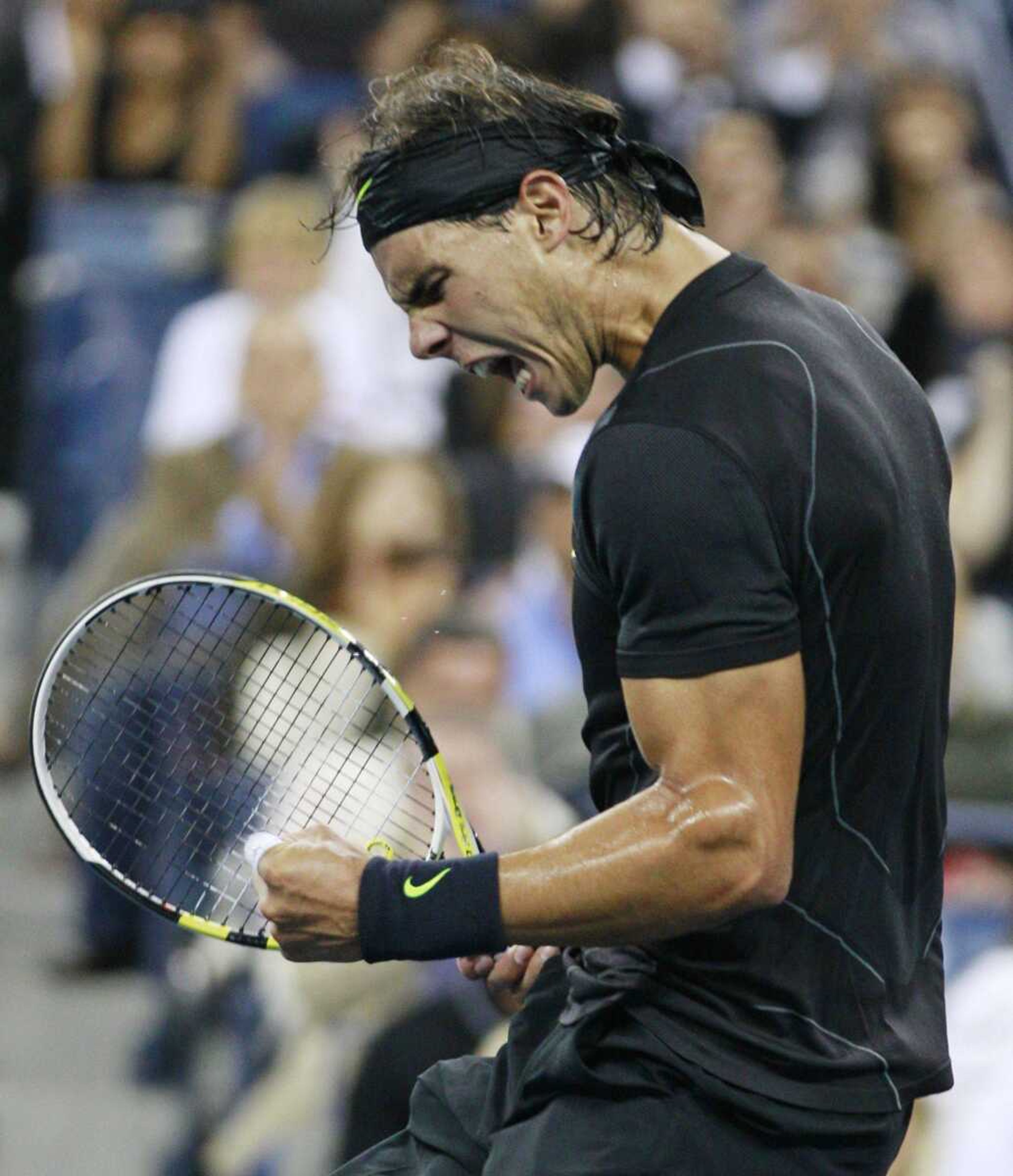 Rafael Nadal reacts after winning the third set against Novak Djokovic during the U.S. Open men's final Monday in New York. (Charles Krupa ~ Associated Press)