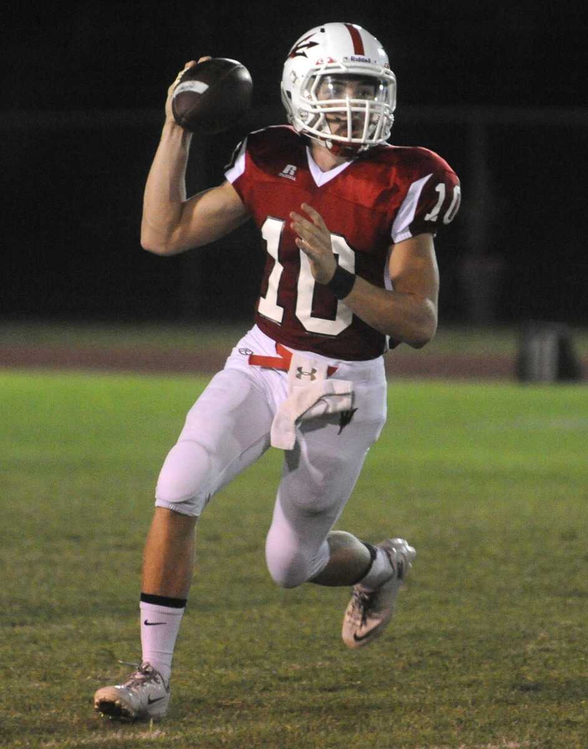 Chaffee quarterback Peyton Montgomery looks for a receiver during the first quarter against Grandview Friday, Aug. 30, 2013 in Chaffee, Mo. (Fred Lynch)