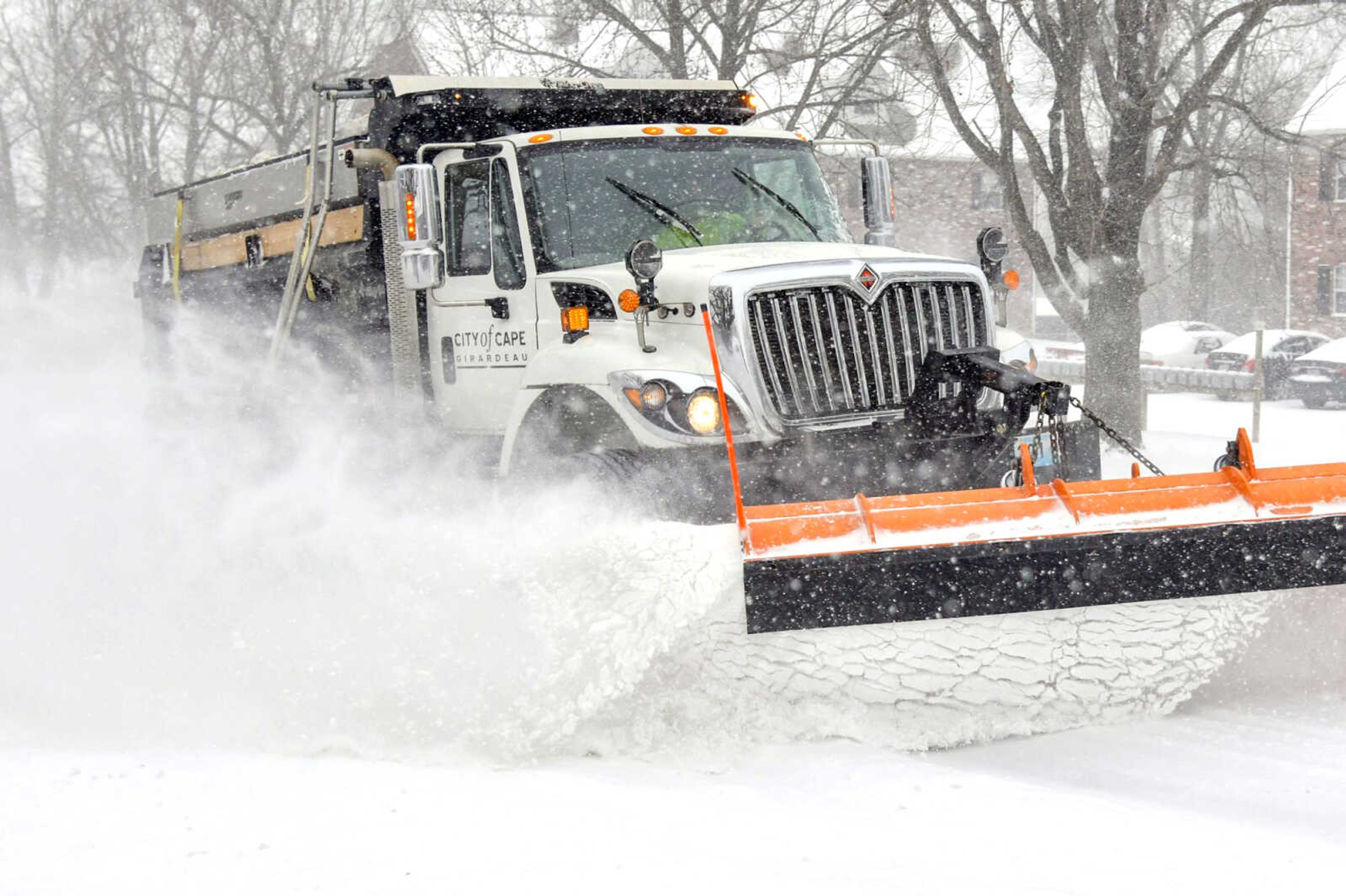 A City of Cape Girardeau snow plow clears snow off the roads Monday in Cape Girardeau.