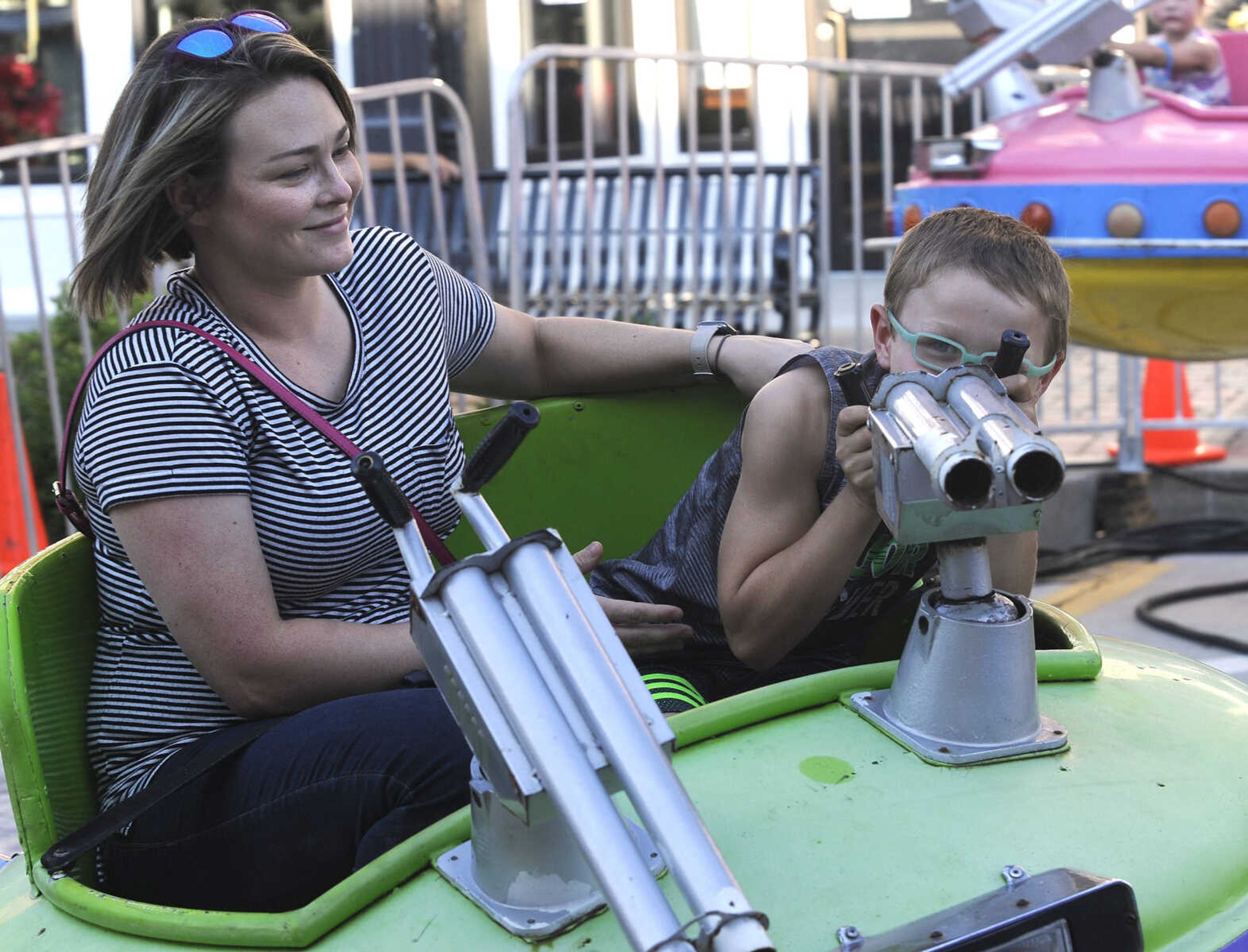 FRED LYNCH ~ flynch@semissourian.com
Natasha Dockins and her son, Matthew, enjoy a carnival ride Tuesday, July 24, 2018 at Homecomers in Jackson.