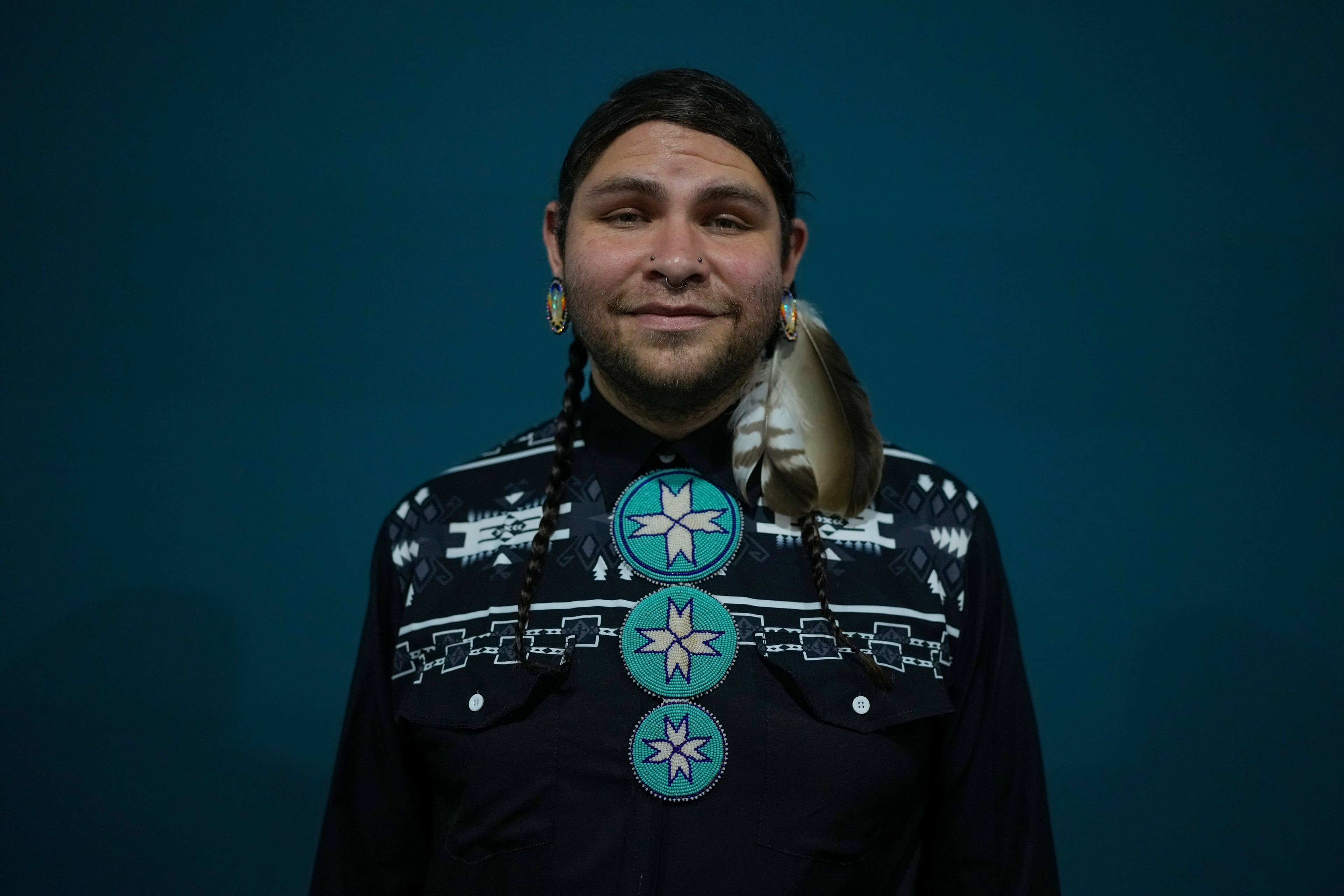 Big Wind Carpenter, 31, of Wind River Reservation, United States, from the Northern Arapaho community, poses for a photo during the COP29 U.N. Climate Summit, Tuesday, Nov. 12, 2024. in Baku, Azerbaijan. (AP Photo/Rafiq Maqbool)