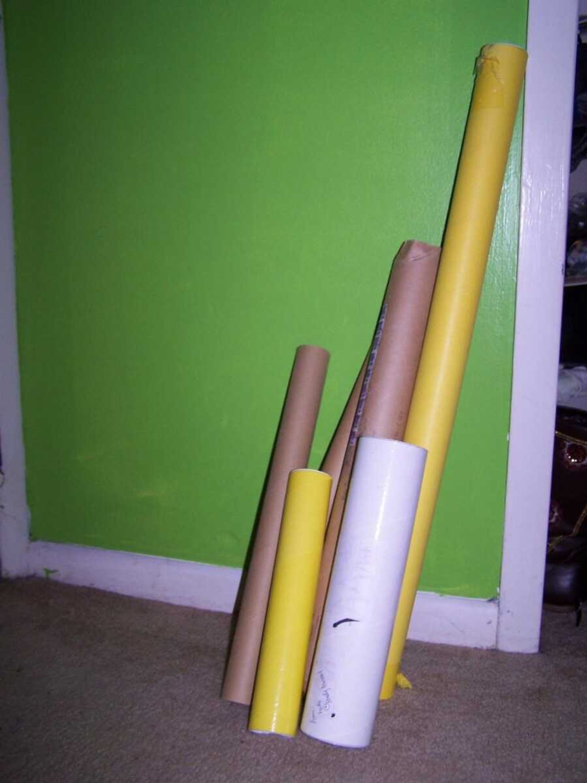 Use mailing tubes cut to different lengths for storing things and reducing clutter.