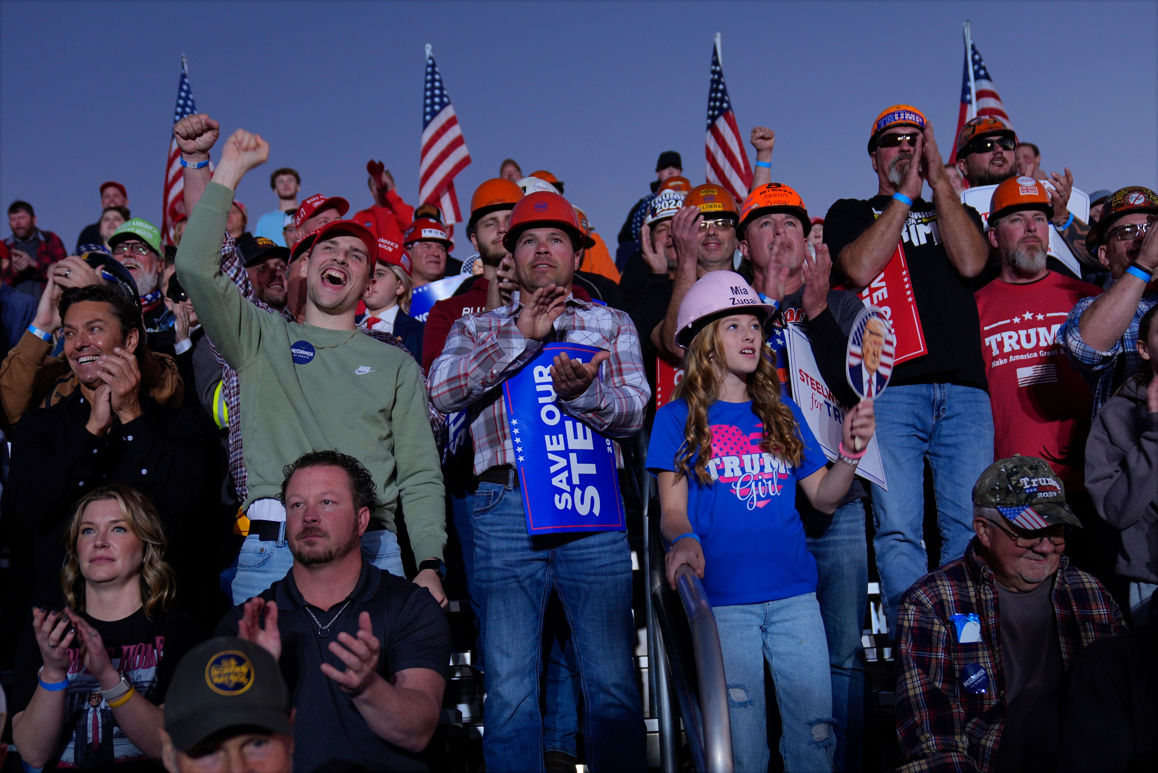 Supporters listen as Republican presidential nominee former President Donald Trump speaks during a campaign rally at Arnold Palmer Regional Airport, Saturday, Oct. 19, 2024, in Latrobe, Pa. (AP Photo/Evan Vucci)