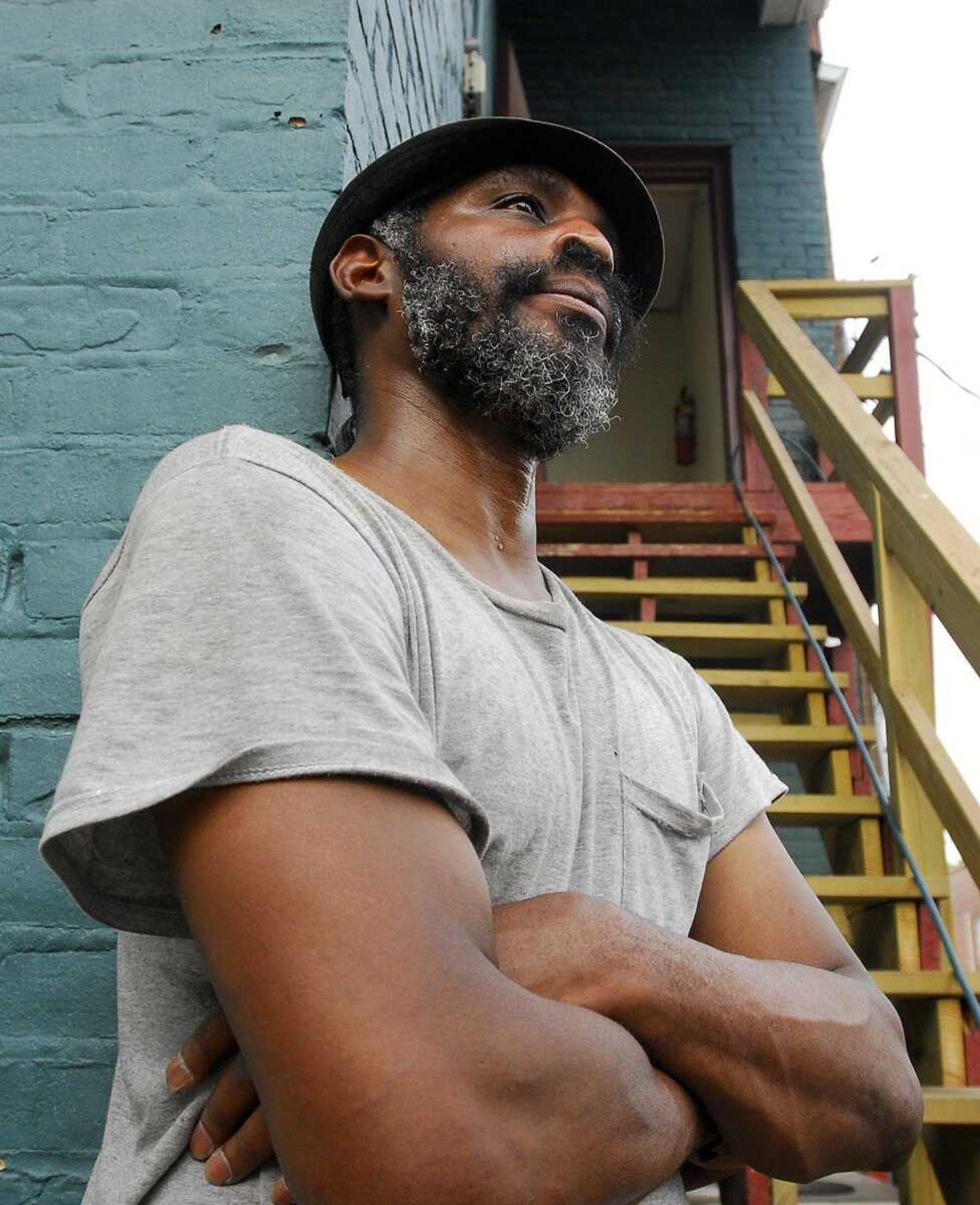 Johnny Brown Jr. poses Monday outside his Cape Girardeau apartment Monday. Brown assisted in a rescue during an early Monday morning fire at Village on the Green apartments. (Laura Simon)