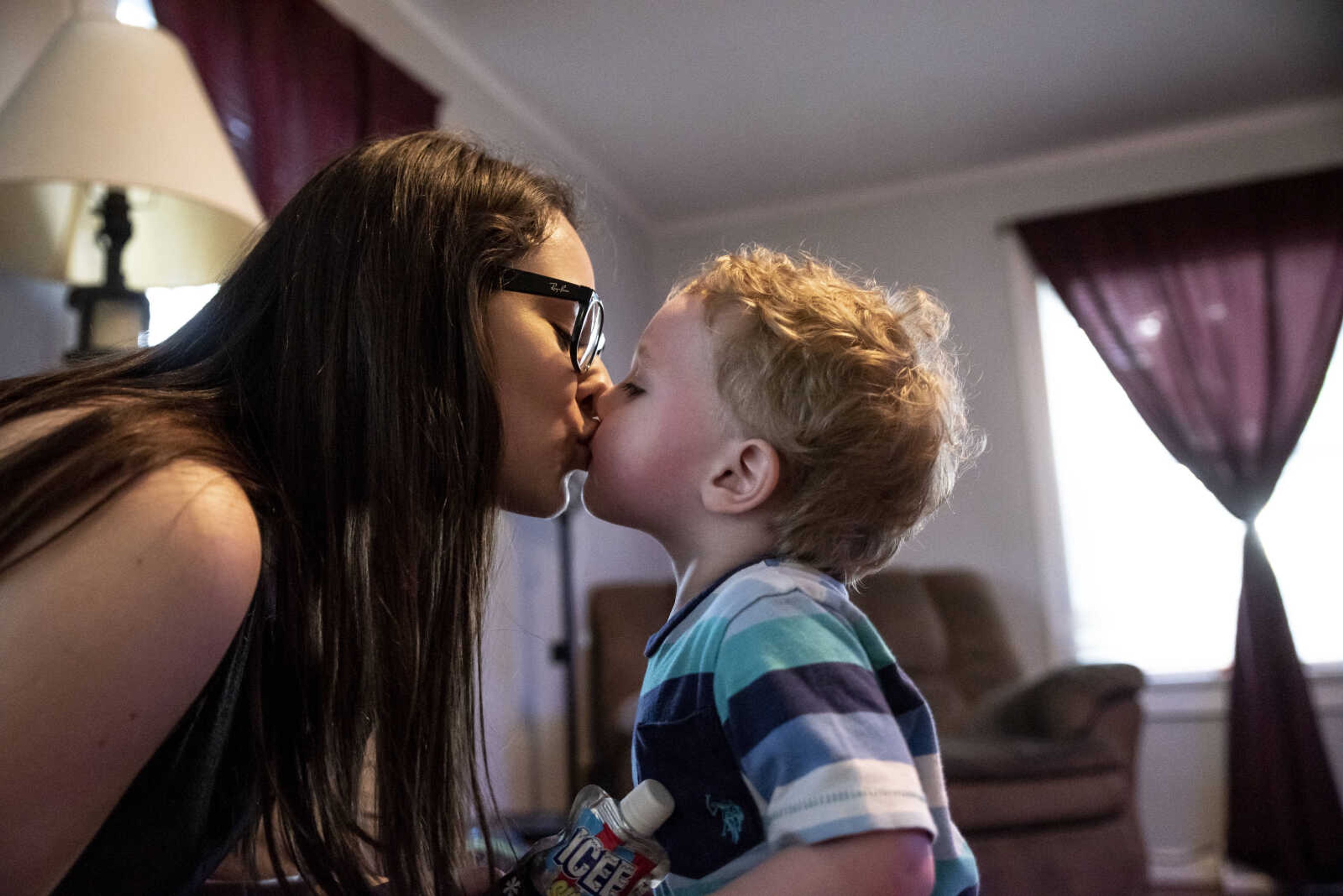 Emily Medlock gets a kiss from her son Phoenix Young, 2, while at home Tuesday, May 7, 2019, in Cape Girardeau.