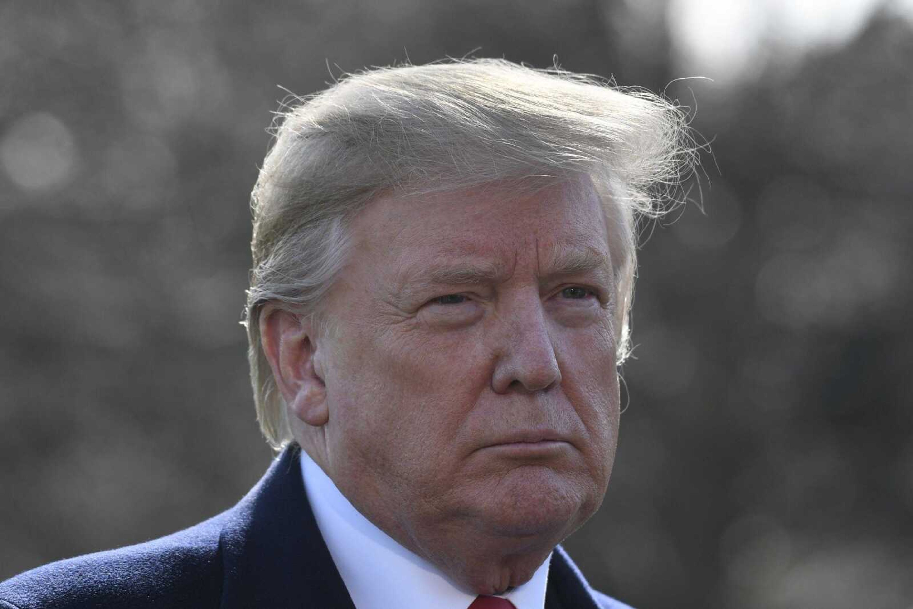 President Donald Trump talks with reporters before boarding Marine One on Thursday on the South Lawn of the White House in Washington for the short trip to Andrews Air Force Base in Maryland.