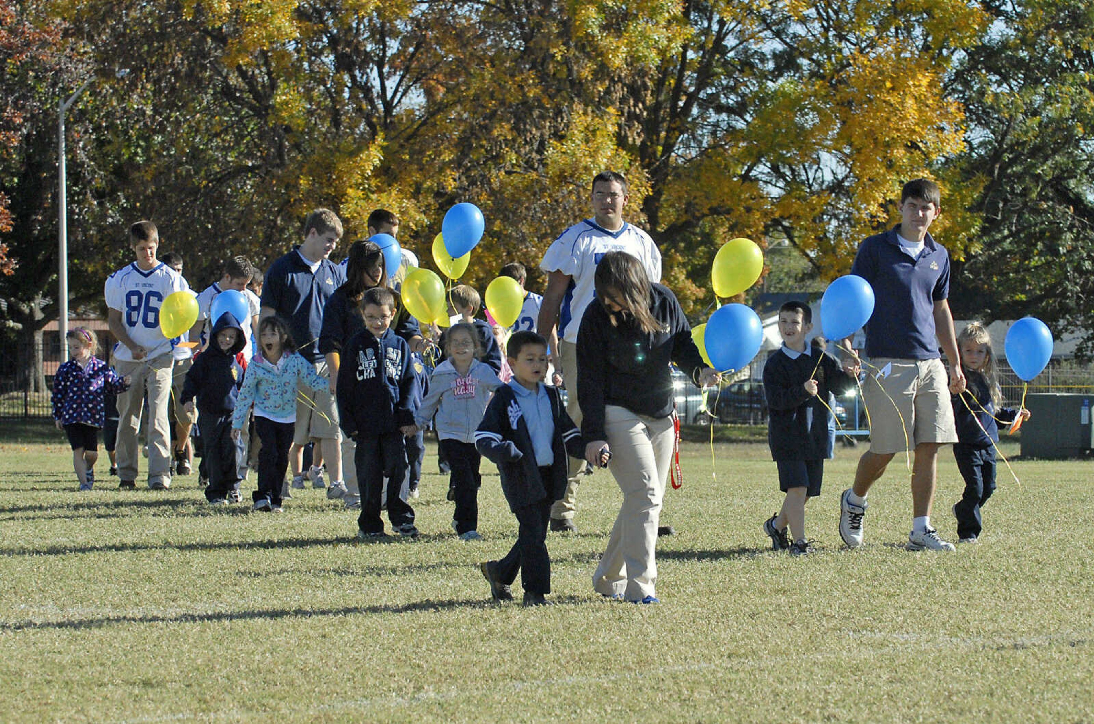 KRISTIN EBERTS ~ keberts@semissourian.com

Kindergarten and senior students at St. Vincent De Paul school prepare to release thank-you prayer balloons during an assembly at St. Vincent De Paul parish in Perryville, Mo., on Friday, Oct. 15, 2010,  to celebrate the school's recognition on the list of the best 50 Catholic secondary schools in America, presented by the Catholic High School Honor Roll. This is the first time St. Vincent has received this distinction.