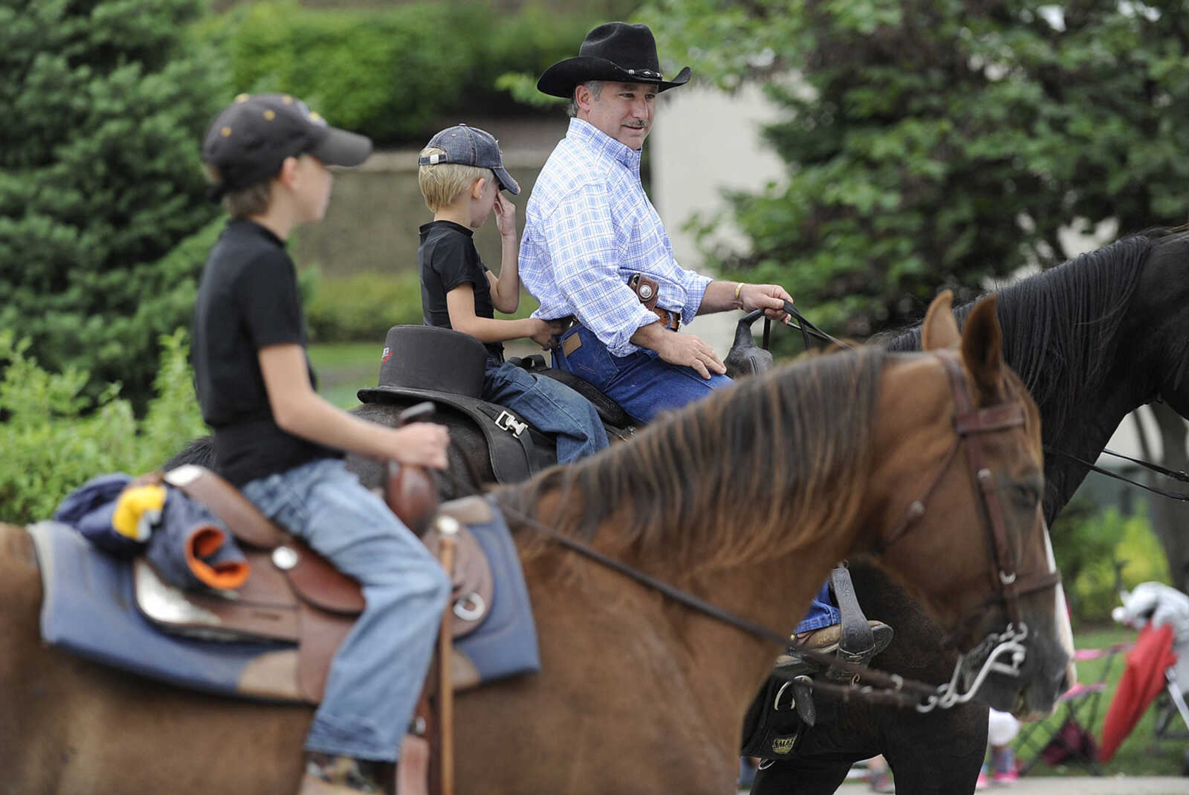 GLENN LANDBERG ~ glandberg@semissourian.com

The SEMO District Fair Parade heads down Broadway after starting in Capaha Park Saturday morning, Sept. 6, 2014, in Cape Girardeau. The parade ended at Arena Park where the 159th annual SEMO District Fair is being held.