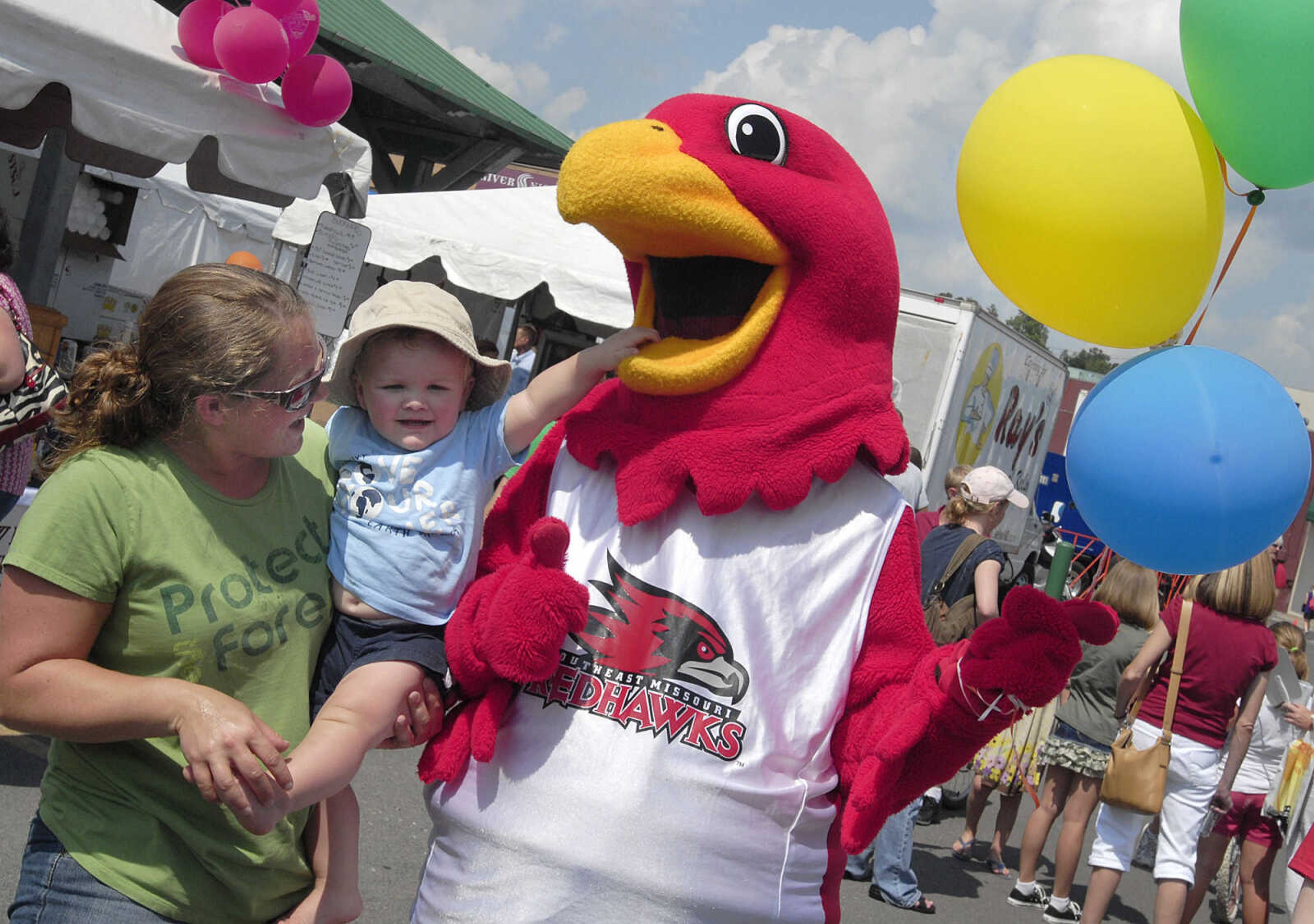 FRED LYNCH ~ flynch@semissourian.com
Rowdy the Redhawk mingles with the crowd and meets 17-month-old Grady Reynolds and his mother, Alisha Reynolds.