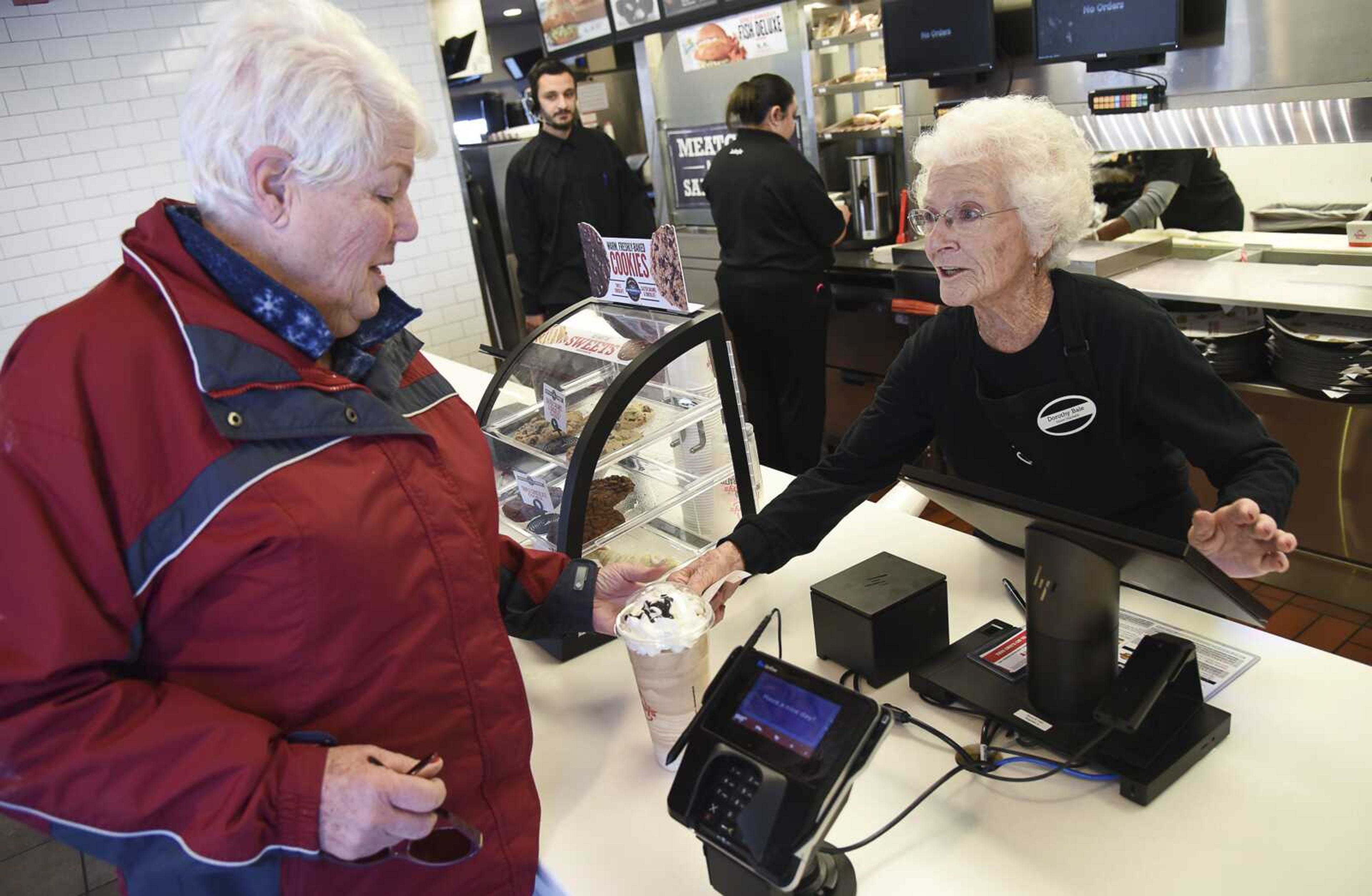 Sharon Grover orders a drink from her longtime friend, 94-year-old Dorothy Bale, who after 25 years at Arby's in Millcreek, Utah, has no plans to retire from the job she started when she was 69.