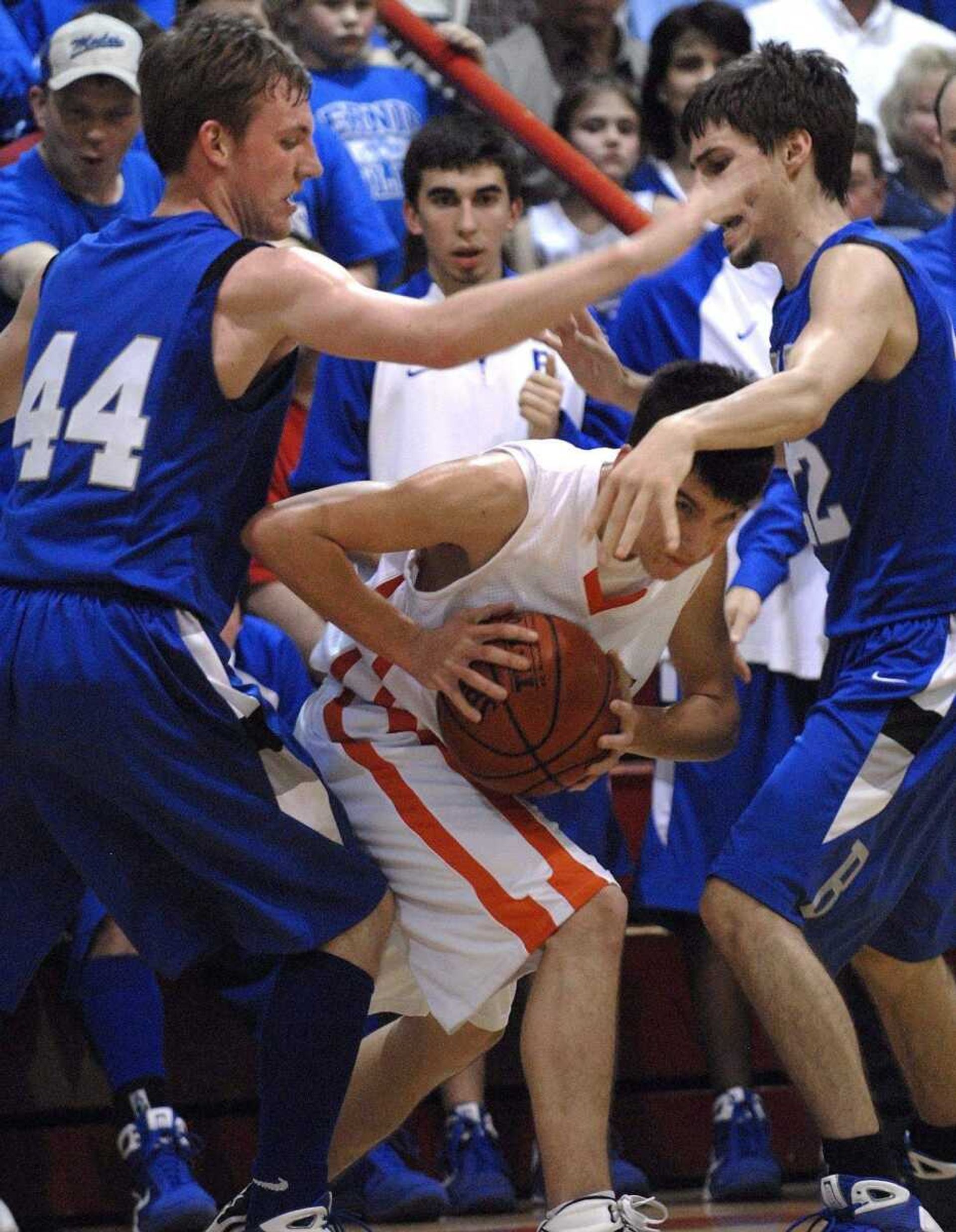 FRED LYNCH ~ flynch@semissourian.comAdvance's Blake Seabaugh is trapped by Bernie's Jordan McGowan, left, and Jacob Owens during the second quarter in the Class 2 District 3 championship game Thursday at Chaffee.