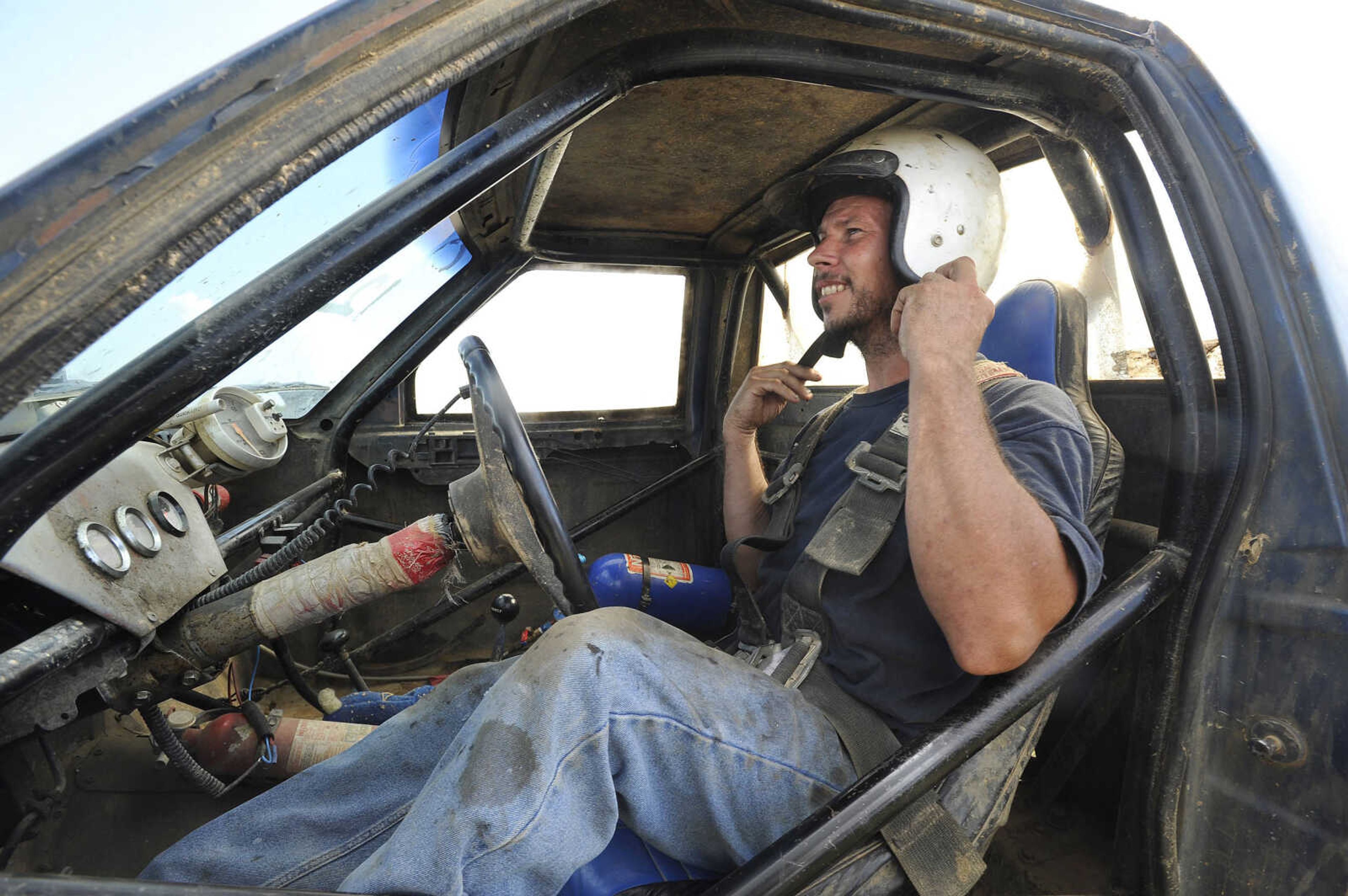 FRED LYNCH ~ flynch@semissourian.com
Eric Enderle of Scott City straps into his truck, Mud Slinger, for the mud-bog event Saturday, Aug. 19, 2017 at Missouri Dirt Motorsports in Sikeston, Missouri.