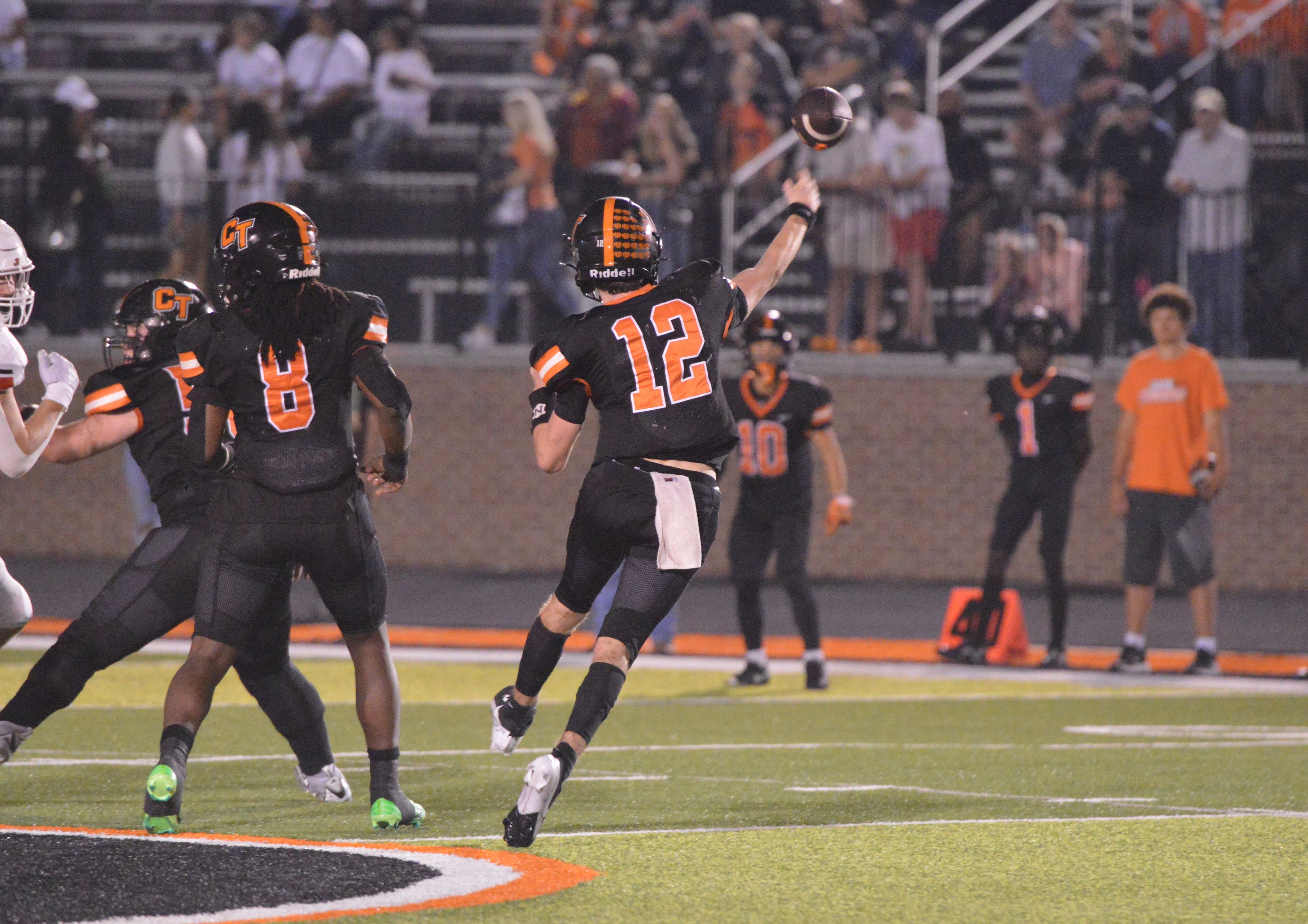 Cape Central quarterback Deklin Pittman slings the ball to his wide receiver Paul Tran late in the fourth quarter against Jackson on Friday, Oct. 4.