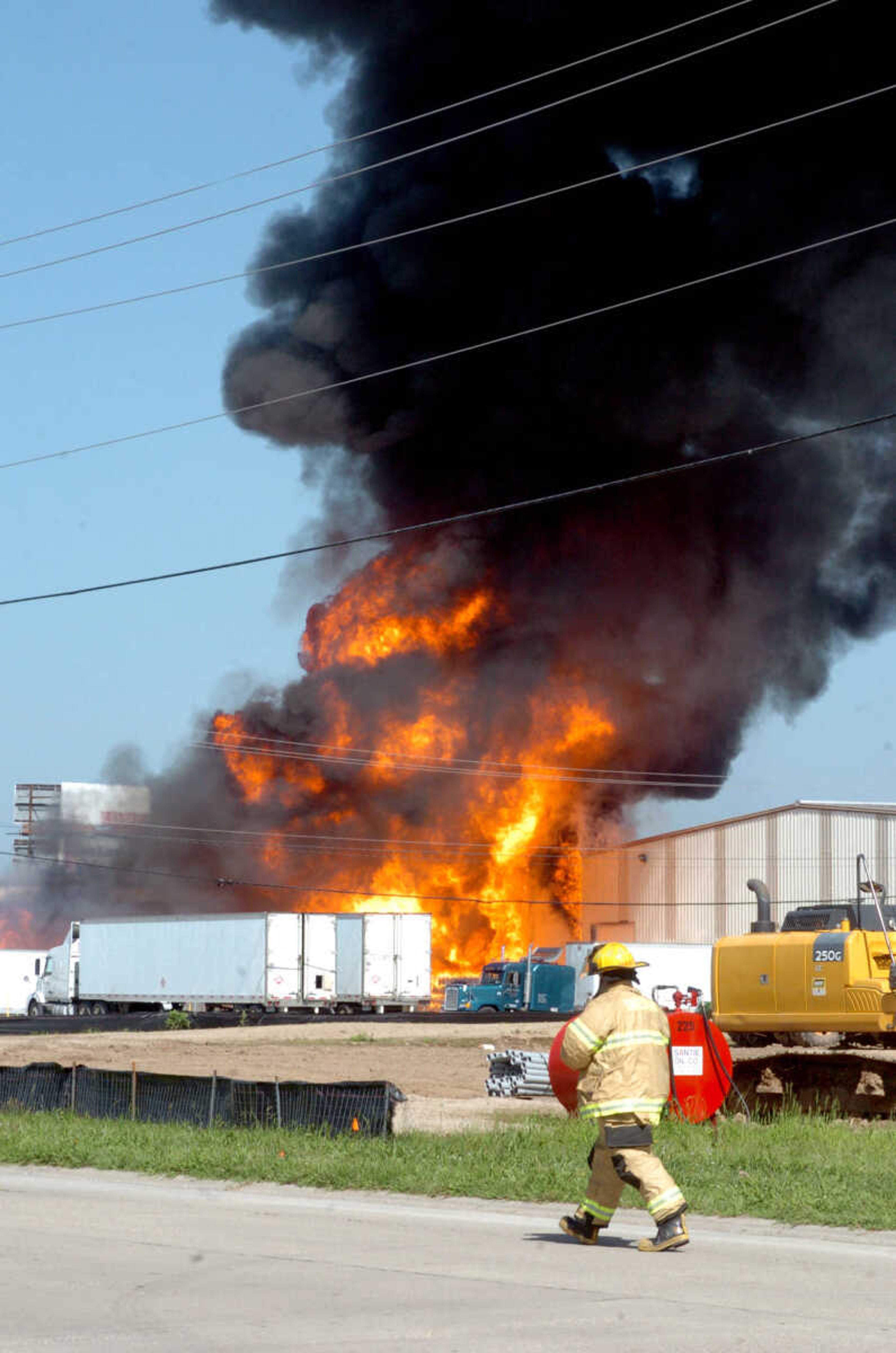 A large blaze broke out Monday morning, July 13, 2015 at Santie Wholesale Oil in Sikeston, Missouri, keeping fire crews busy for hours. (Photo courtesy of The Standard Democrat)