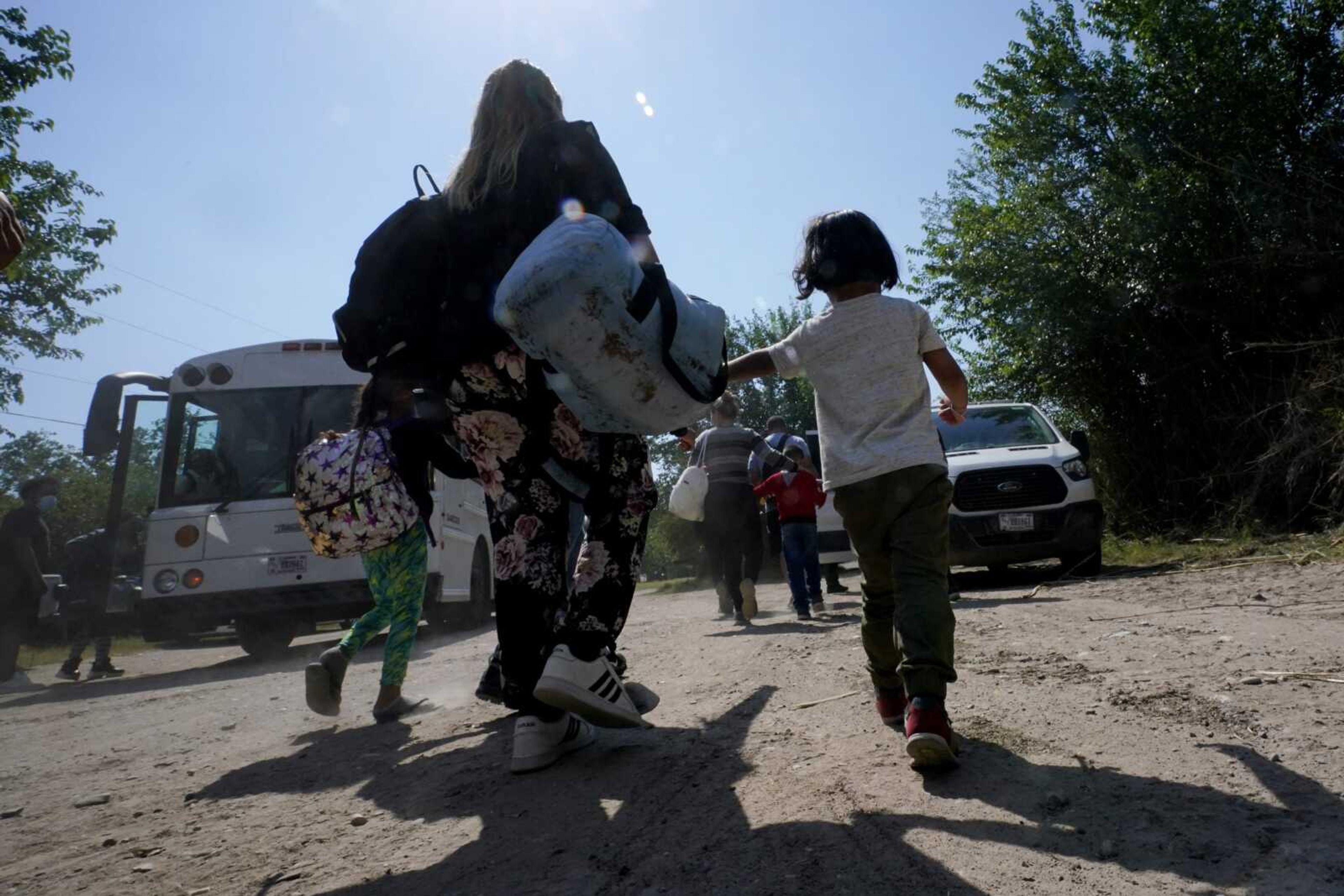 A migrant family from Venezuela walks to a Border Patrol transport vehicle after they and other migrants crossed the U.S.-Mexico border and turned themselves in June 16, 2021, in Del Rio, Texas. The Biden administration has agreed to accept up to 24,000 Venezuelan migrants, similar to how Ukrainians have been admitted after Russia's invasion, while Mexico has agreed to accept some Venezuelans who are expelled from the United States, the two nations said Wednesday.