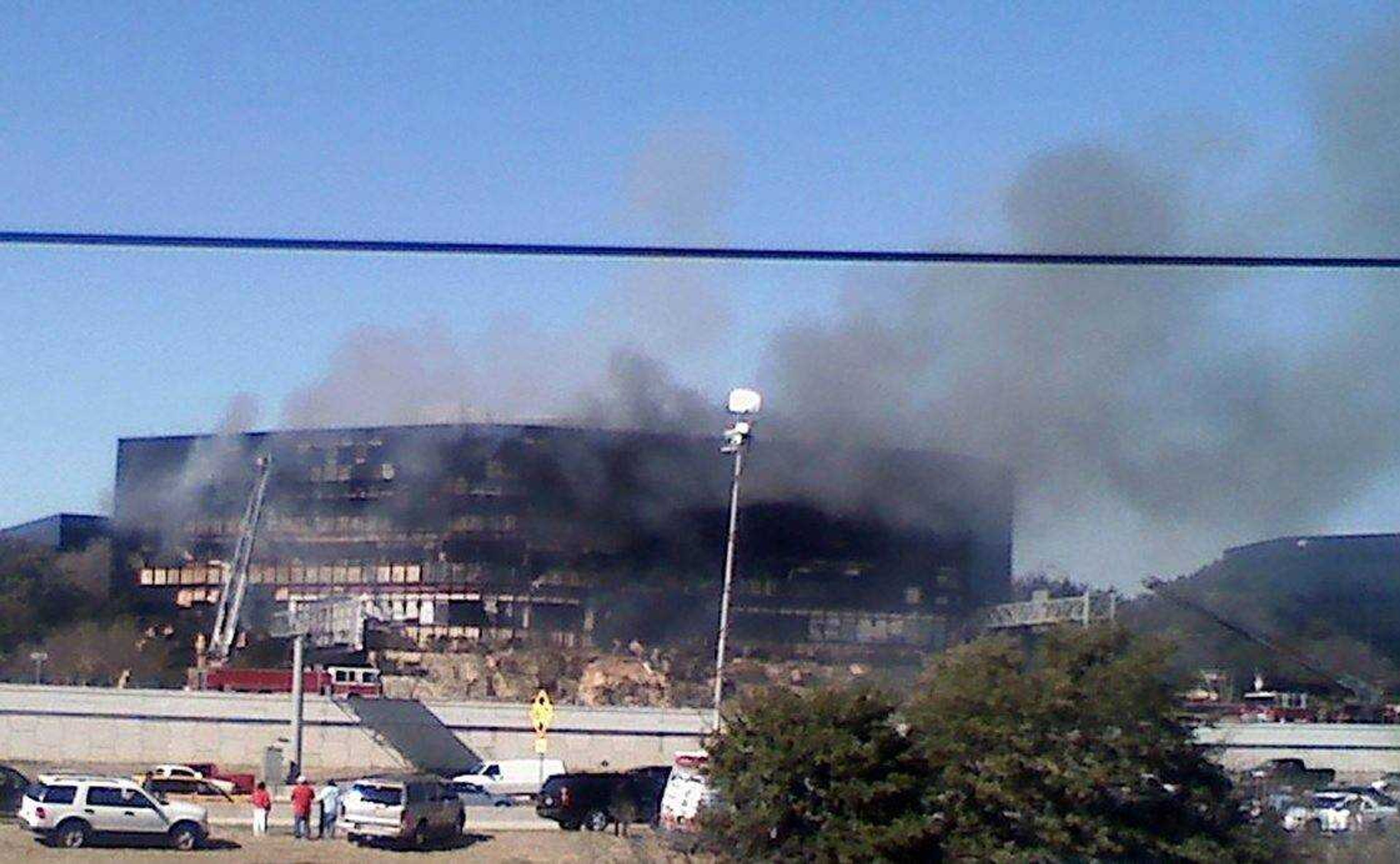 Smoke billows from a seven-story building after a small private plane crashed into the building  in Austin, Texas on Thursday Feb. 18, 2010. (AP Photo/Austin American-Statesman, Claudia Grisales)