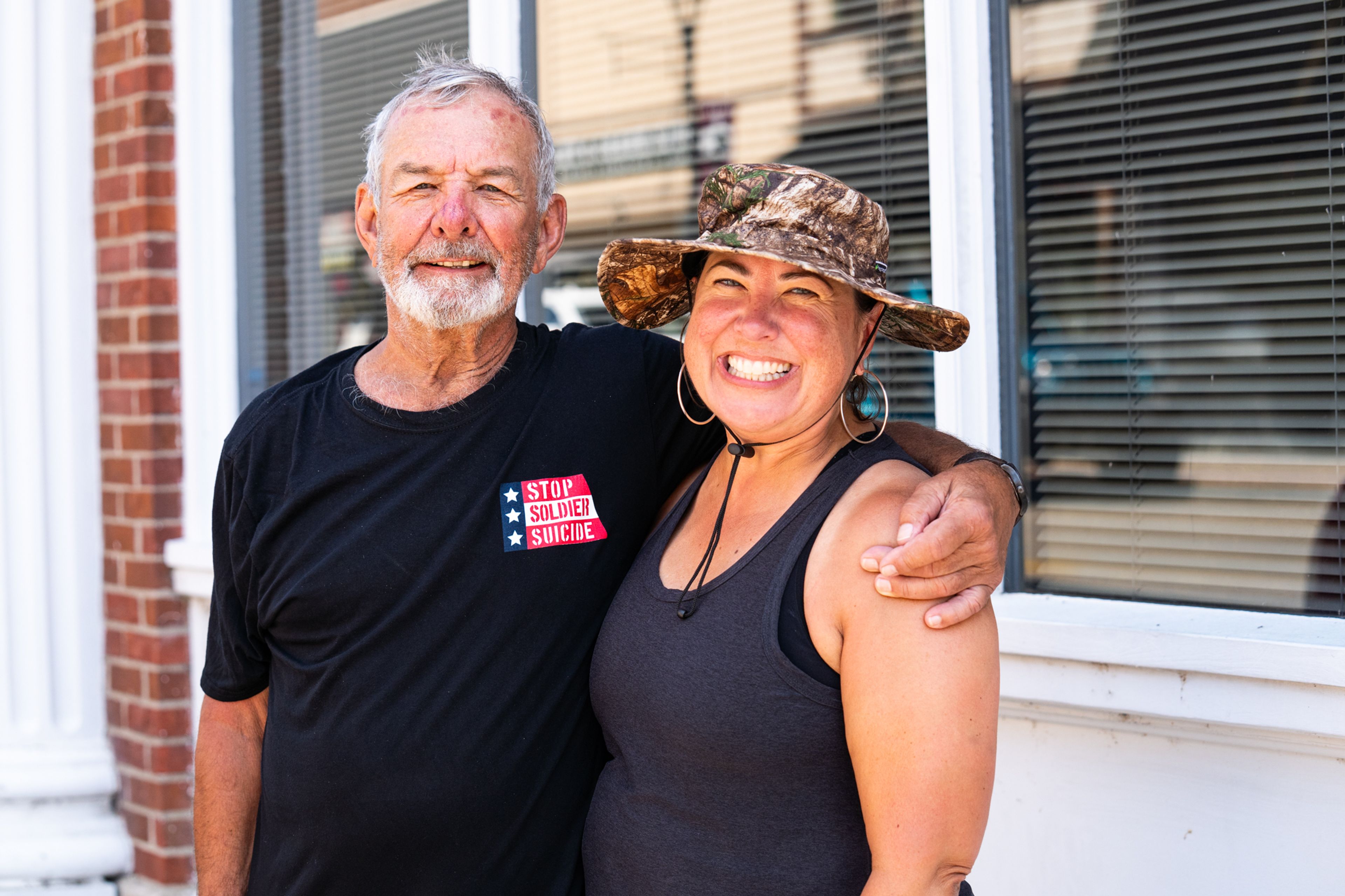 Frank Lachinski and his daughter Nicole Maves stand together downtown after getting rescued  by the Cape Girardeau Fire Department on Friday, Aug. 23.