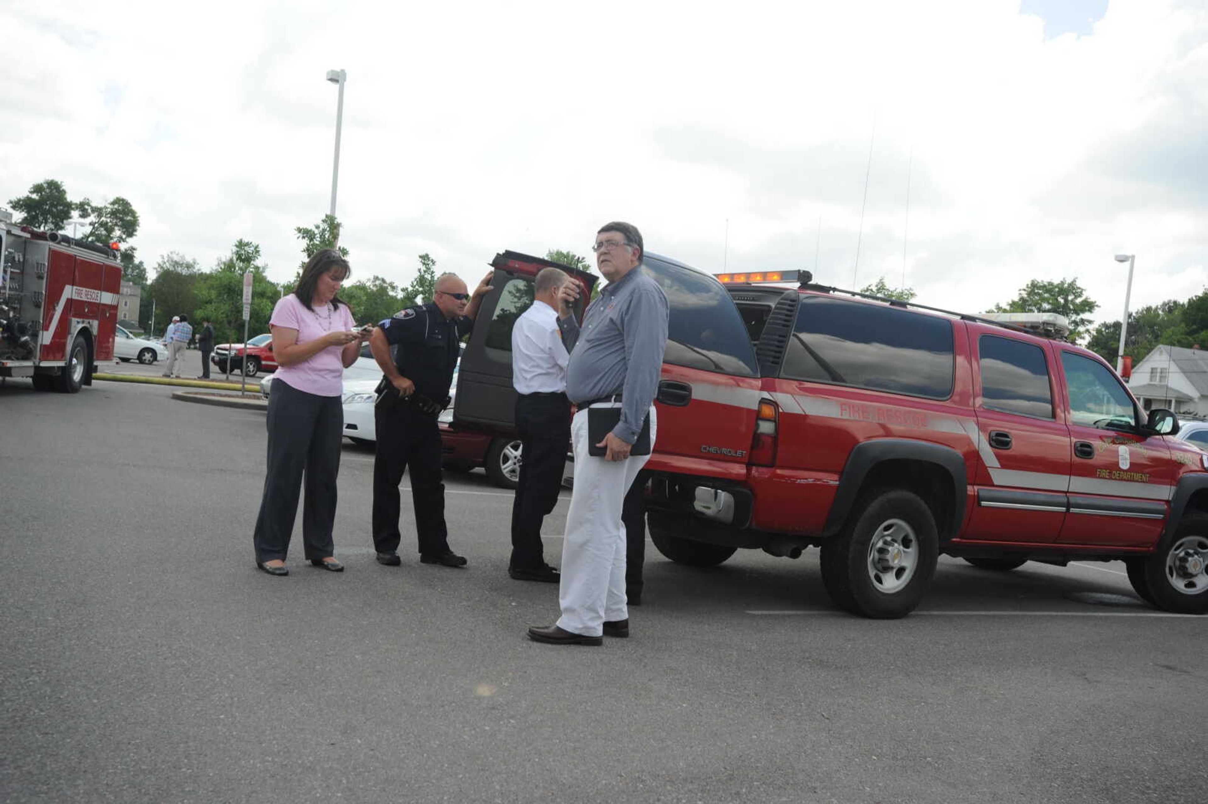 Dr. Ken Dobbins, Southeast Missouri State University president, looks on the scene as firefighters work to put out a fire at Dempster Hall on the university's campus. (Laura Simon)