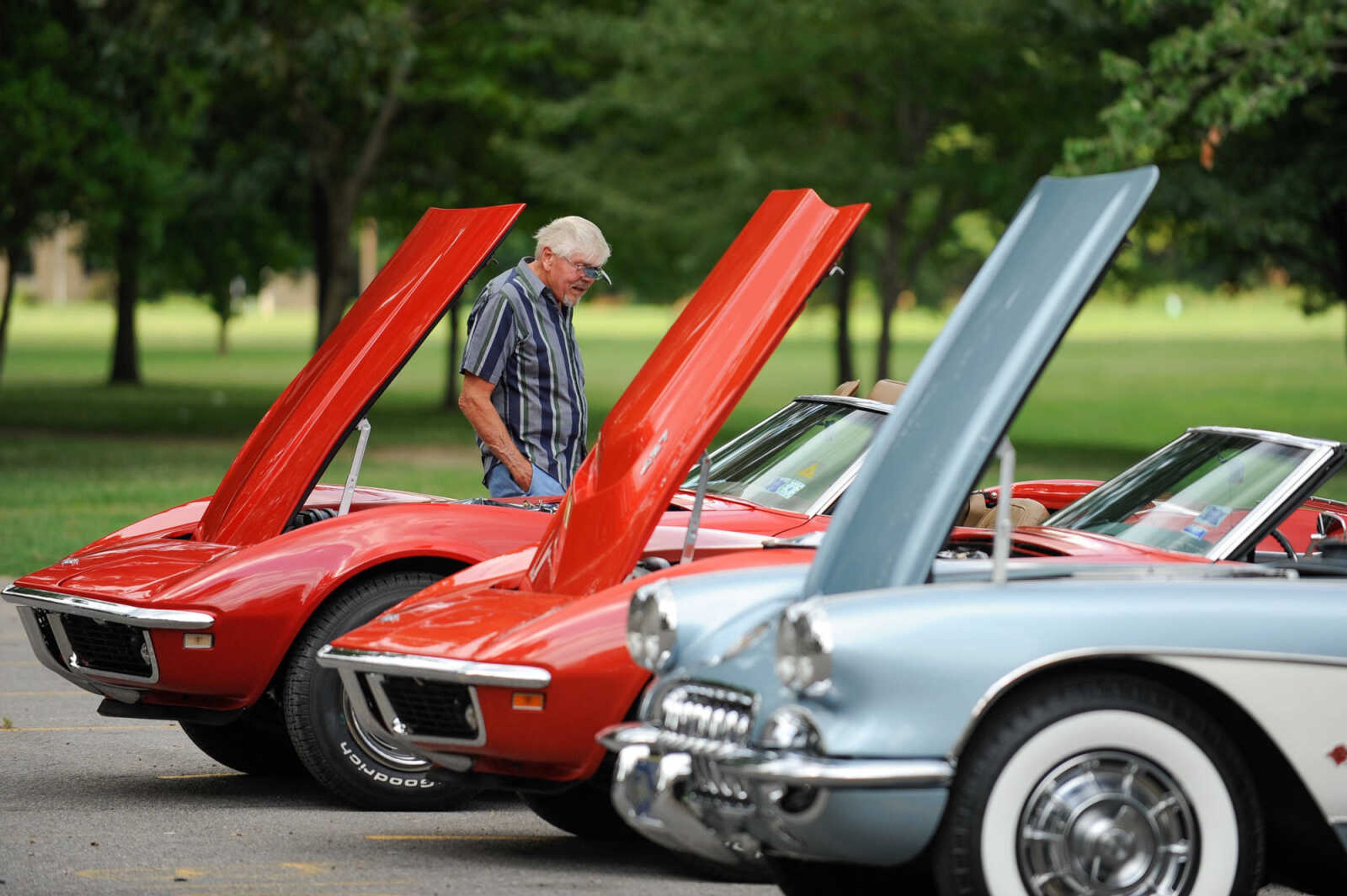 GLENN LANDBERG ~ glandberg@semissourian.com

Bill Mabrey of Scott City looks over a group of  Chevrolet Corvettes during the Rev'n Rods & Heartland Music Tour stop at Arena Park Tuesday, July 19, 2016 in Cape Girardeau.