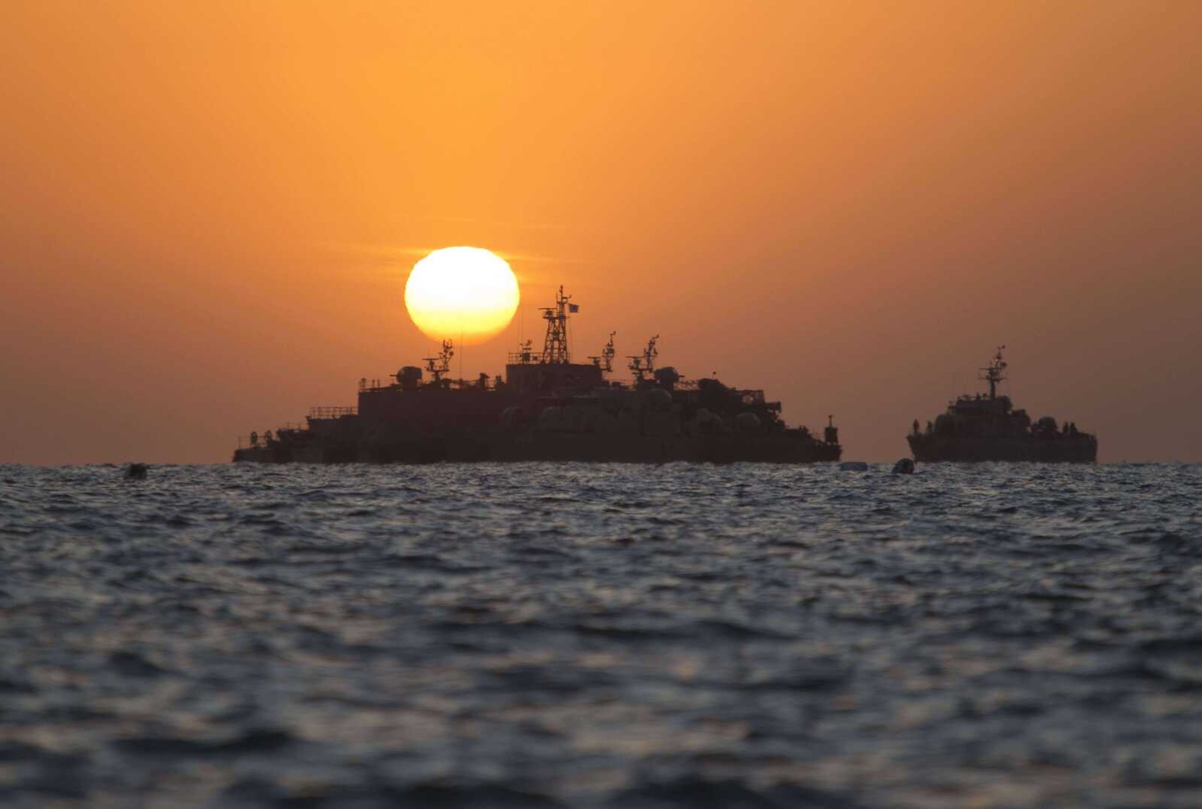 South Korean ships stage Sunday off of the coast of South Korea's Yeonpyeong Island. The United States and South Korea prepared for war games Sunday as South Koreans demanded vengeance over a deadly North Korean artillery bombardment that has raised fears of more clashes between the bitter rivals. (David Guttenfelder ~ Associated Press)