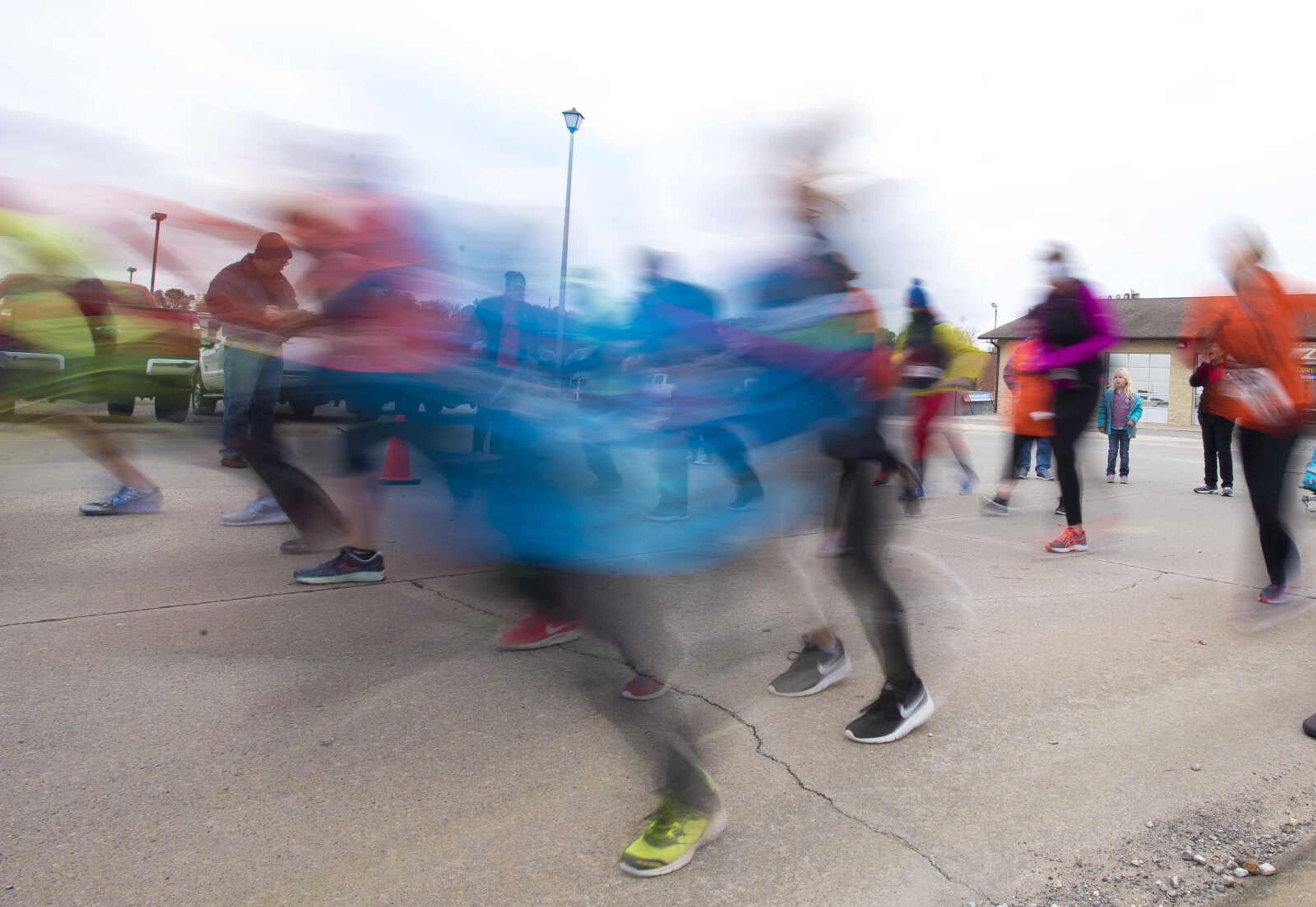 Runners take off during the first Ghost and Goblin Gallop 5k race to raise money for the Crossroads Backpack Fair on Saturday, Oct. 28, 2017 in Jackson.