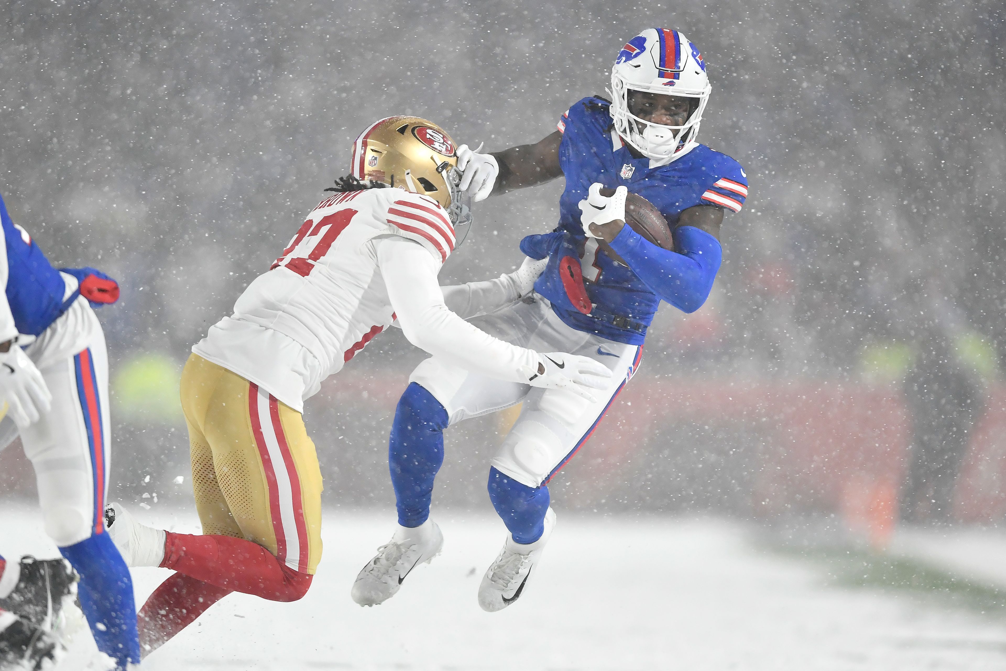 Buffalo Bills wide receiver Curtis Samuel, right, is tackled by San Francisco 49ers safety Ji'Ayir Brown during the second half of an NFL football game in Orchard Park, N.Y., Sunday, Dec. 1, 2024. (AP Photo/Adrian Kraus)