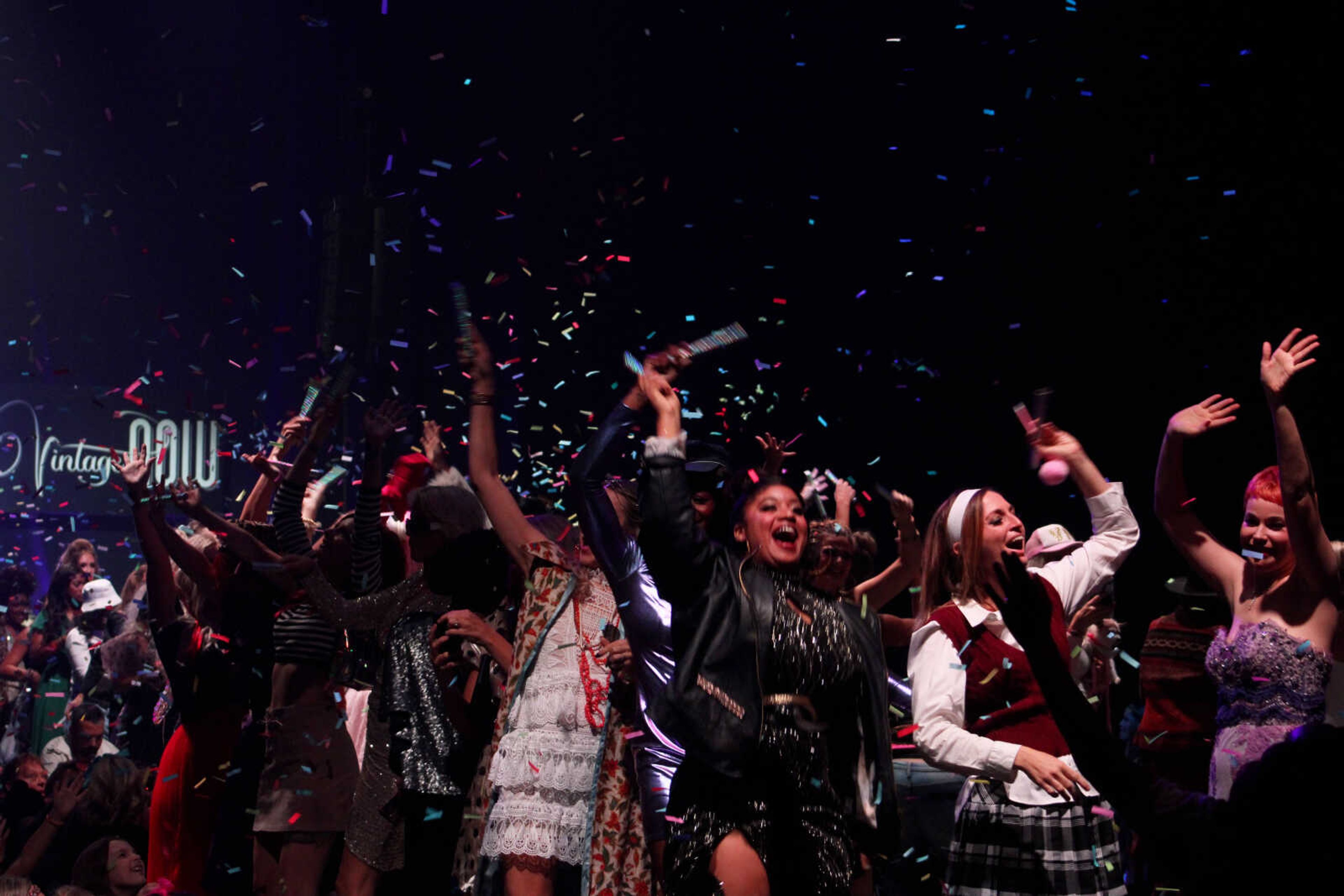 Confetti and balloons rain down on community women who served as models in the 11th VintageNOW fashion show following their performance Saturday, Oct. 9, 2021, at the Show Me Center in Cape Girardeau.