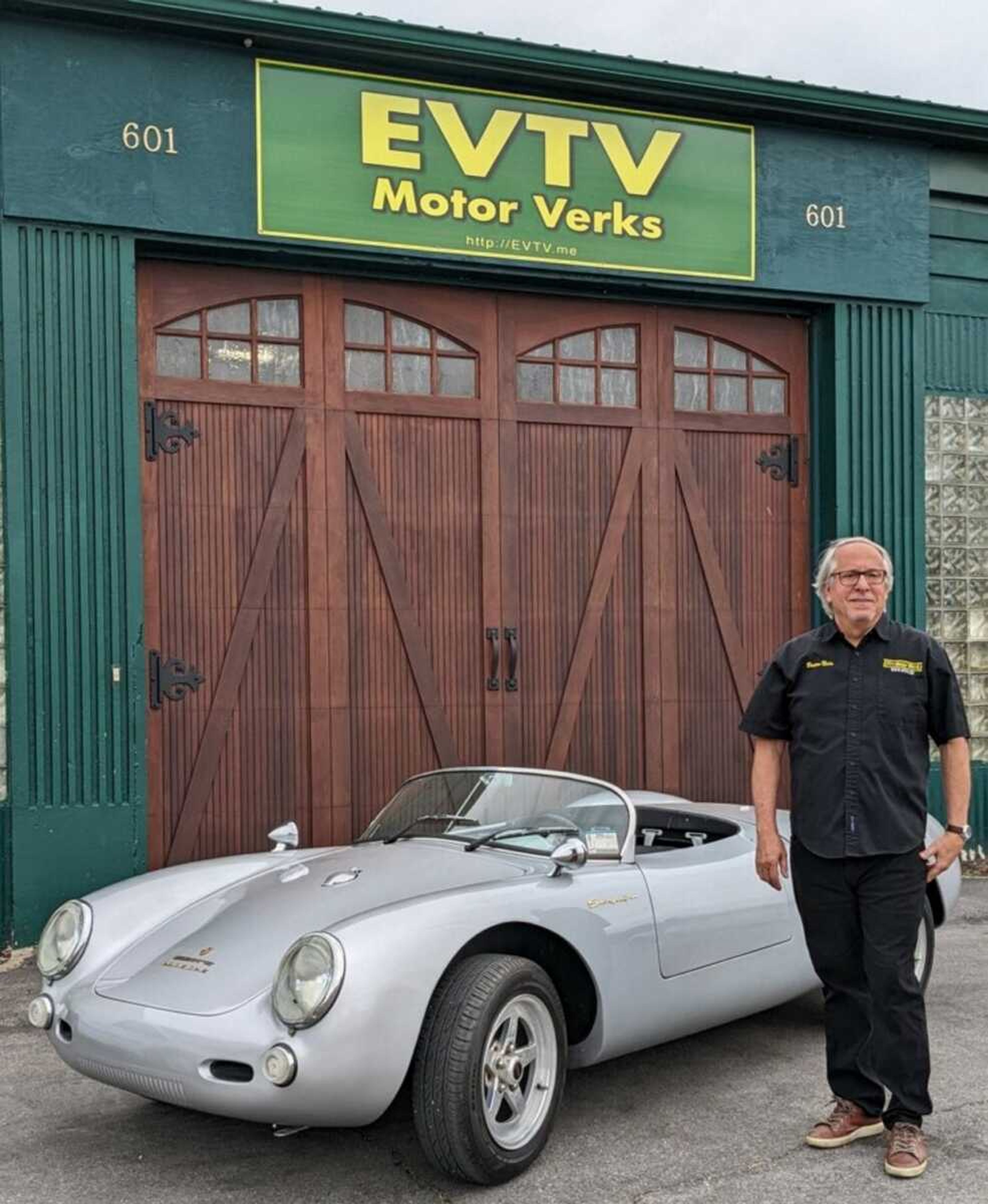 Brian Noto stands next to a 100% battery electric 1957 Porsche Spyder 500 replica car. Noto is director of energy for EVTV Motor Verks, 601 Morgan Oak St. in Cape Girardeau.