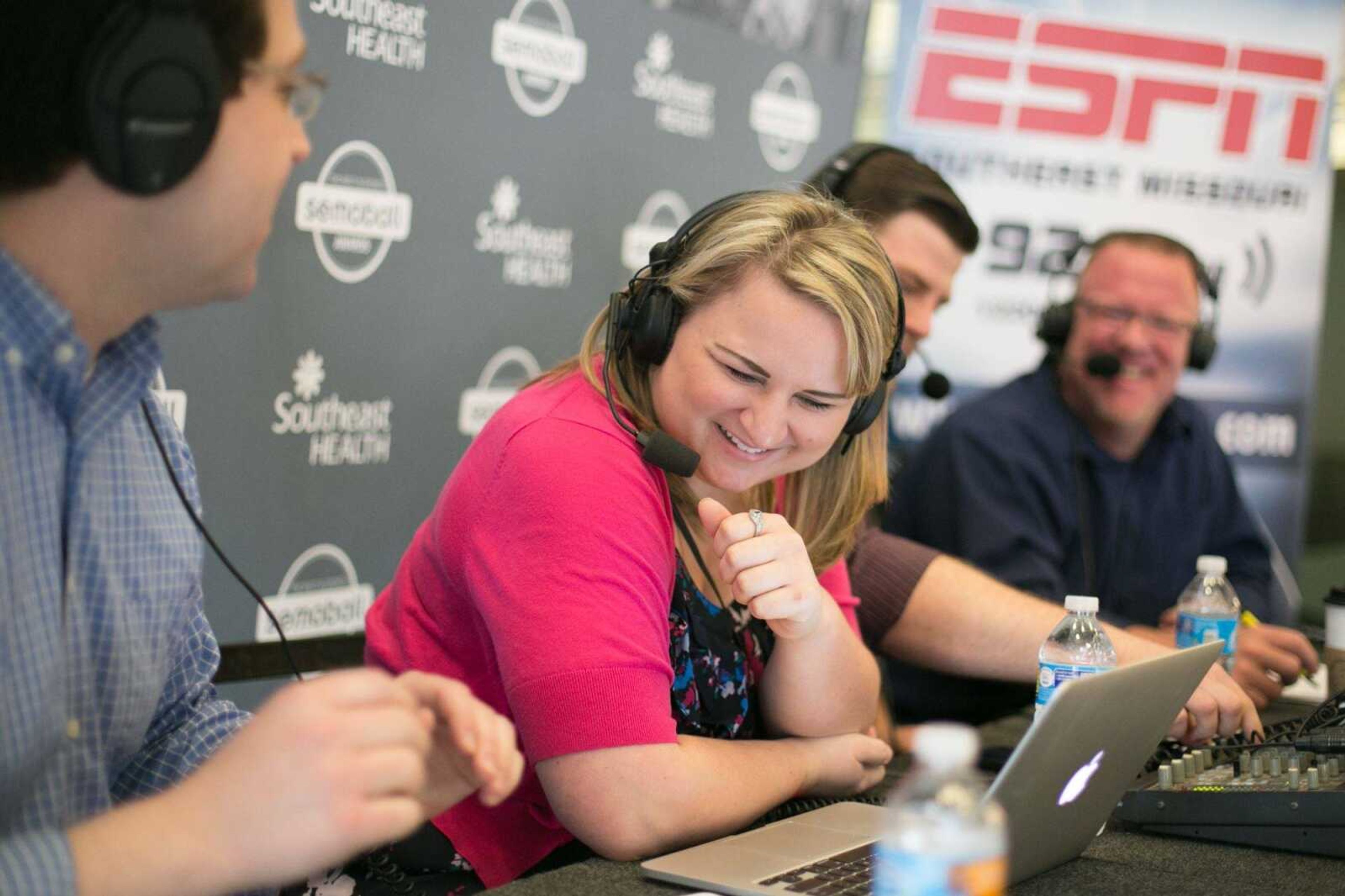 Rachel Crader, editor of Semoball.com, shares in a laugh with Semoball Awards event manager Lucas Presson, left, Cody Sandusky and Mike Baker, cohosts of Saturday Morning Express on SEMO ESPN radio during the Semoball Awards spring sports selection show at First Midwest Bank Saturday, June 13, 2015 in Cape Girardeau. (Glenn Landberg)