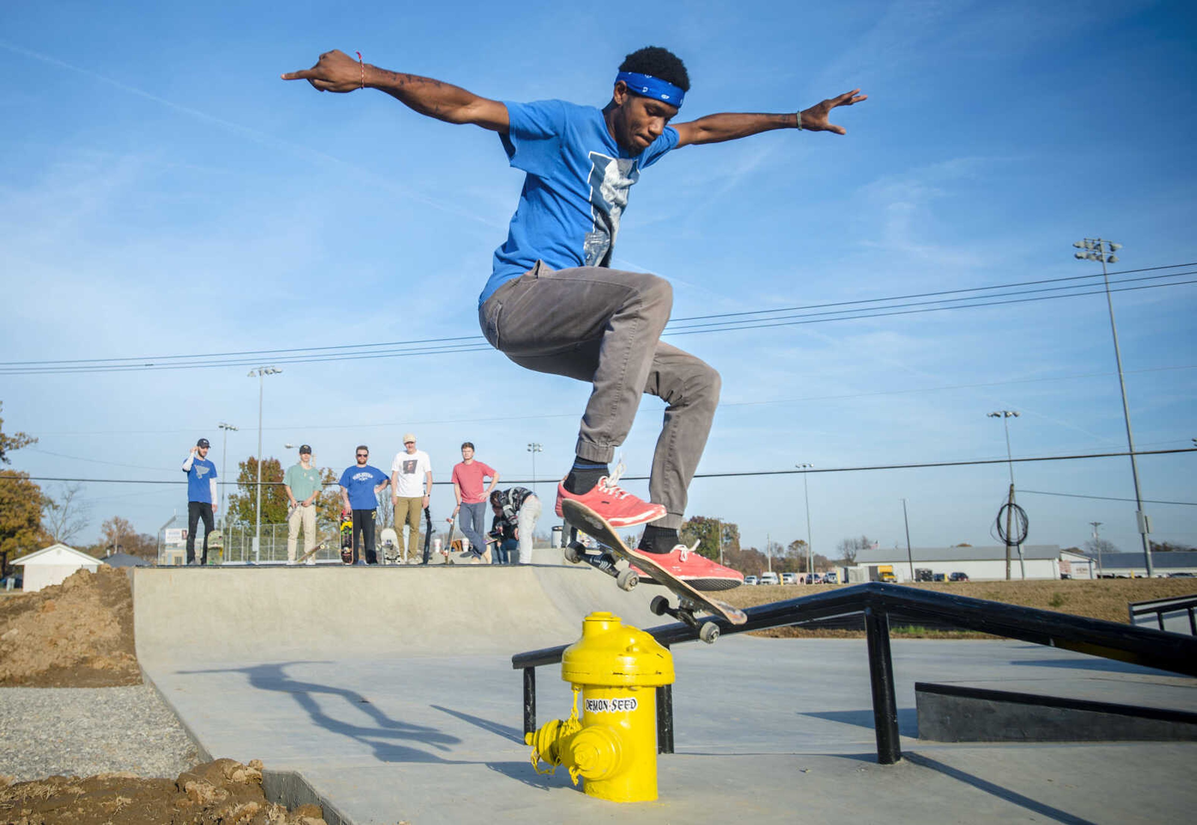 Duwan Harris performs a switch 180 over a fire hydrant in the new skate park Nov. 17, 2018, at Arena Park in Cape Girardeau.