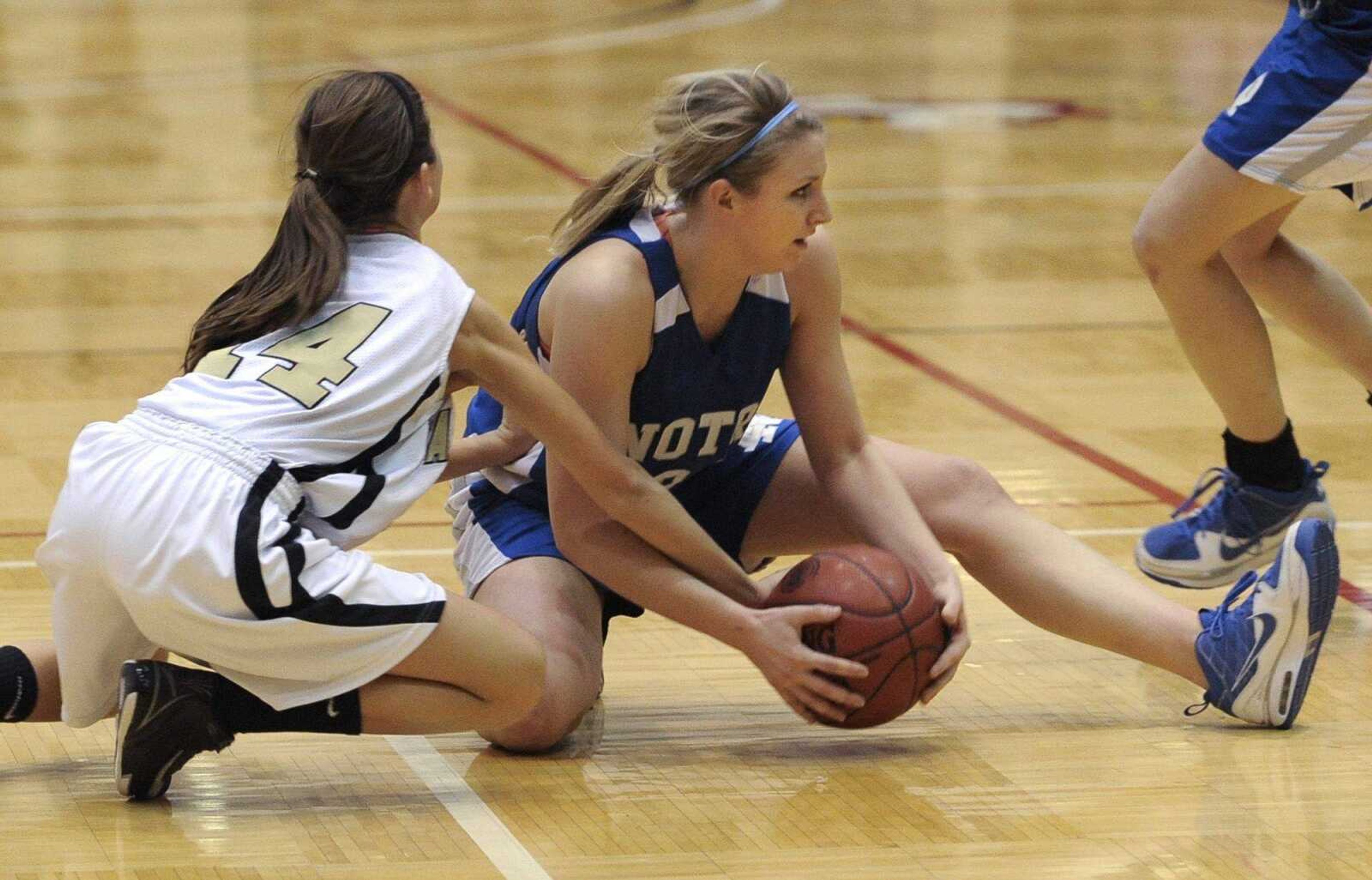 Notre Dame point guard Allyson Bradshaw tries to keep the ball away from a Farmington player in the Class 4 sectional game in Park Hills, Mo. Bradshaw is Notre Dame's leading scorer this season. (Fred Lynch)