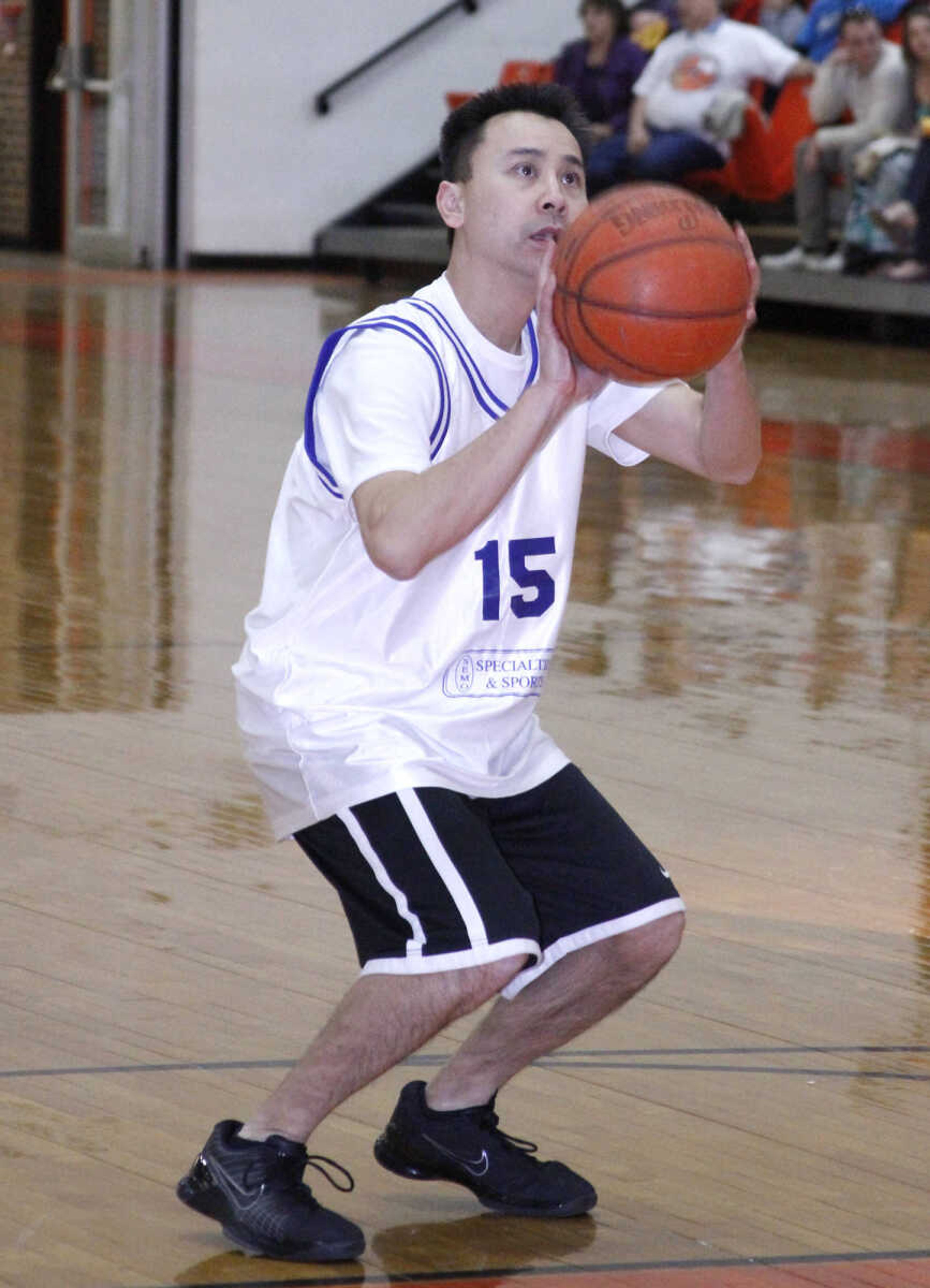 JONATHAN BRIDGES ~ photos@semissourian.com
Dr. Duc Nguyen takes a shot from the free throw line. Saturday, March 3, 3012 during the 19th annual Doctors vs. Lawyers basketball showdown at Cape Central Junior High School in Cape Girardeau. Doctors won 84-70.