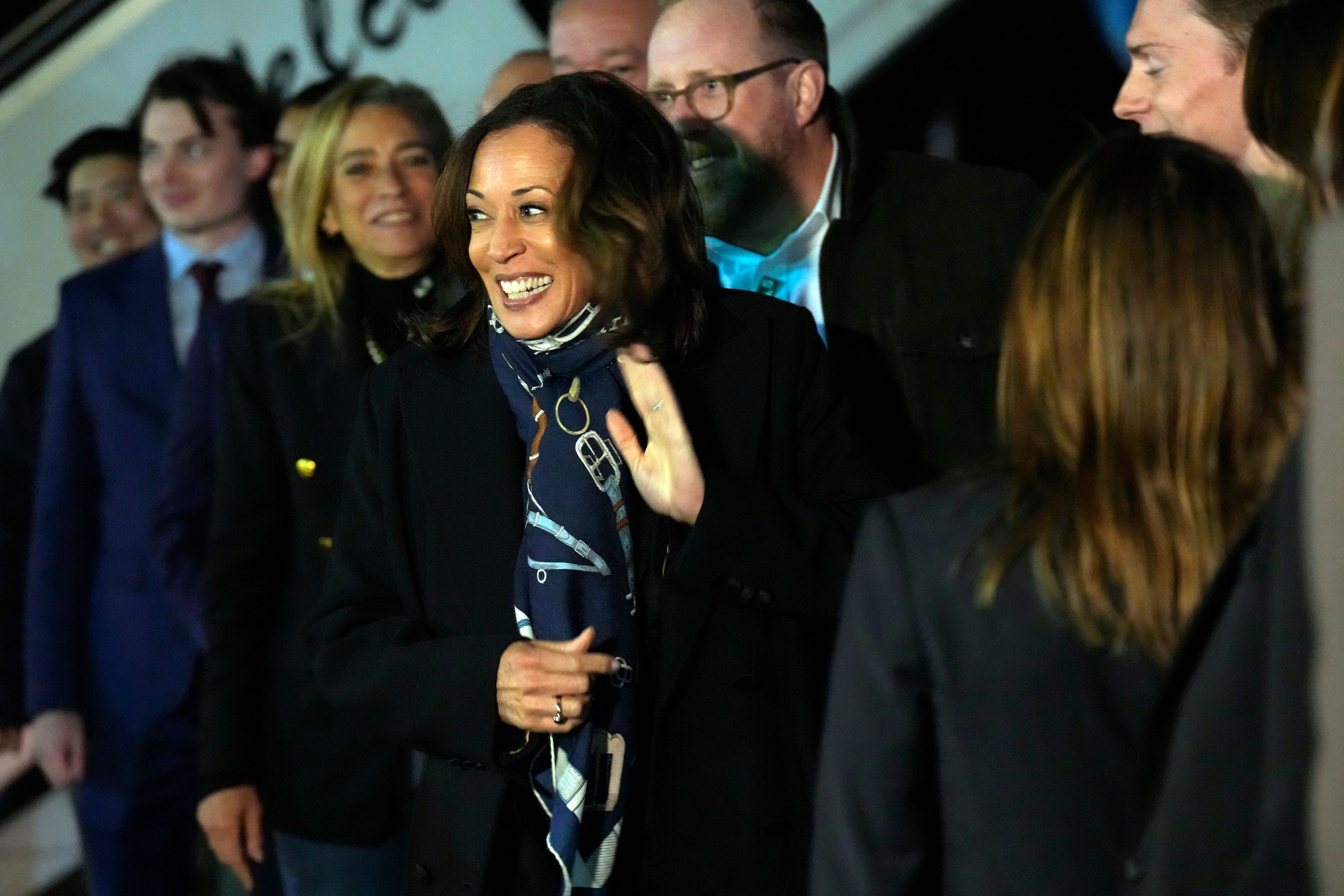 Democratic presidential nominee Vice President Kamala Harris talks with local staff before she departs Erie International Airport, in Erie, Pa., Monday, Oct. 14, 2024, after a campaign rally. (AP Photo/Jacquelyn Martin)