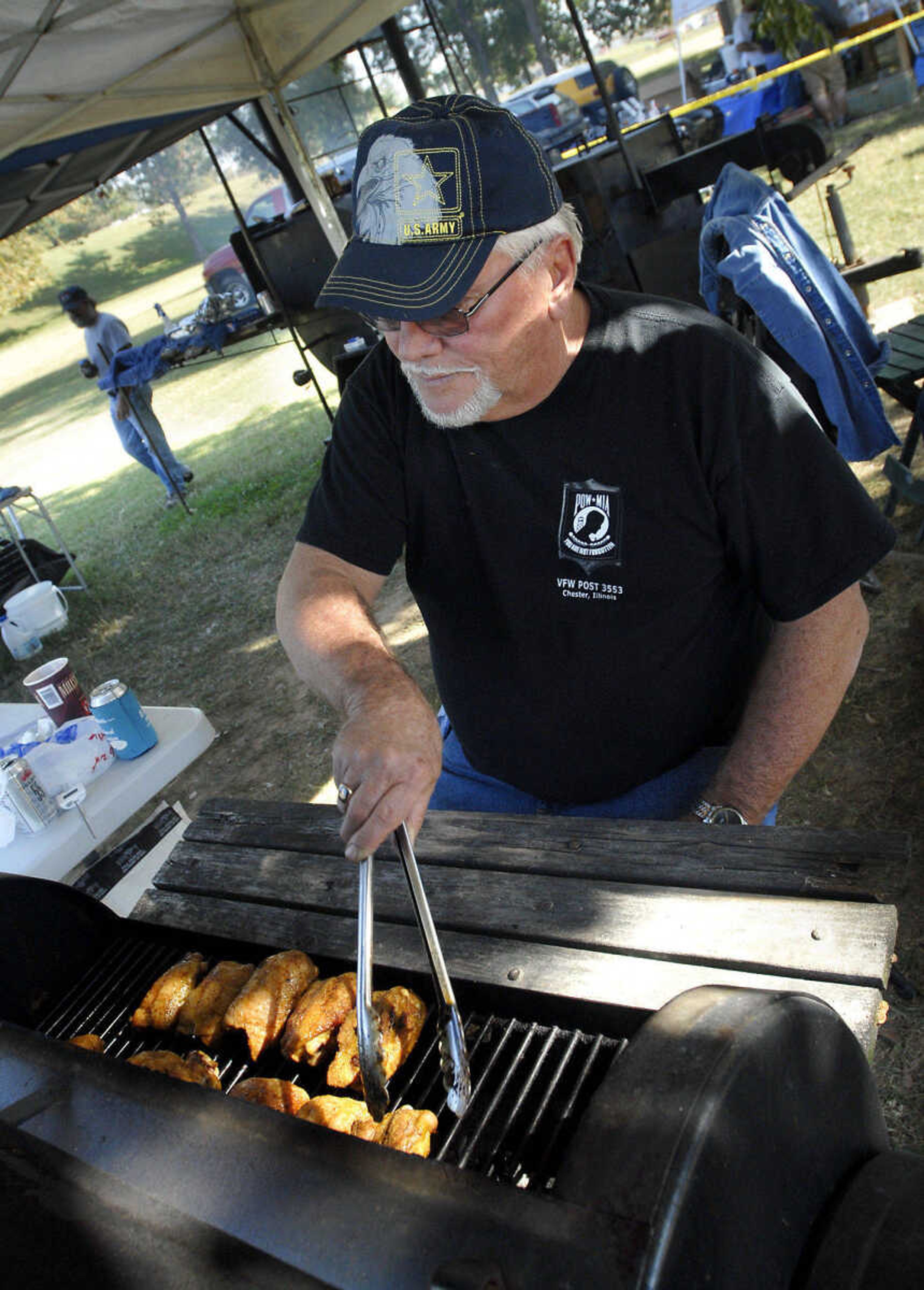 KRISTIN EBERTS ~ keberts@semissourian.com

Kenny Ragland, of VFW Post 3553 out of Chester, Ill., turns over his chicken during the 2010 Jackson Bar-B-Que Cook Off on Saturday, Oct. 9, at Jackson City Park.