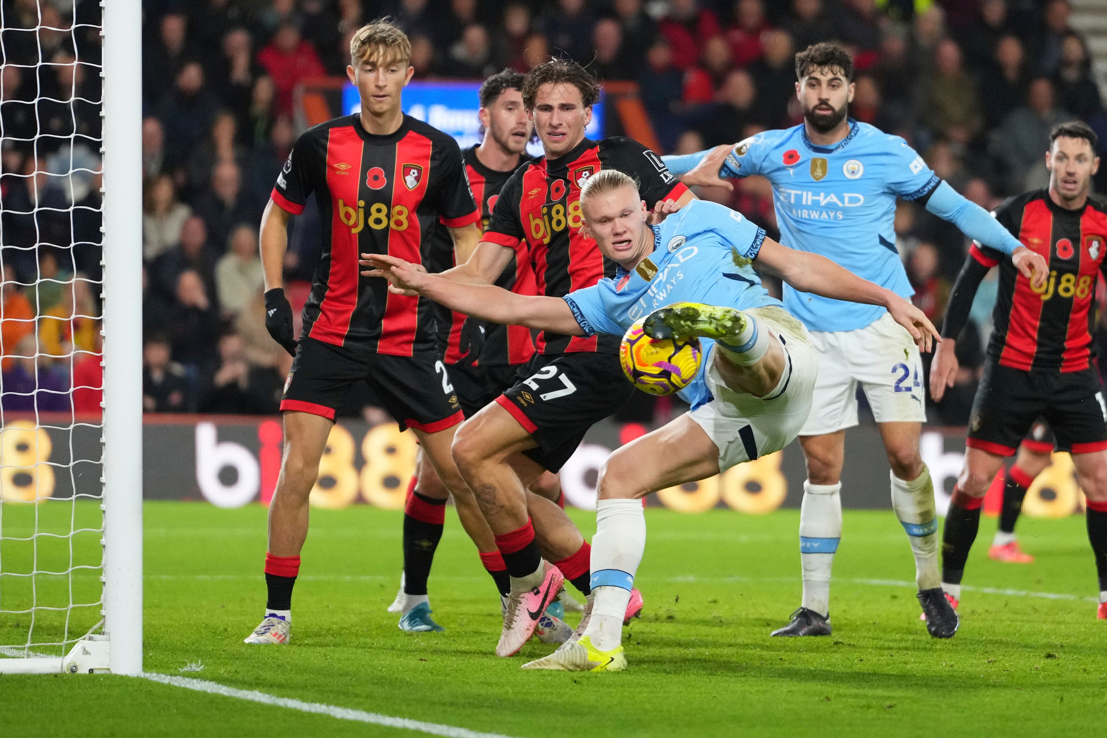 Manchester City's Erling Haaland hits a rebound against the post during the English Premier League soccer match between Bournemouth and Manchester City at the Vitality stadium in Bournemouth, England, Saturday, Nov. 2, 2024, Bournemouth won the game 2-1. (AP Photo/Kirsty Wigglesworth)