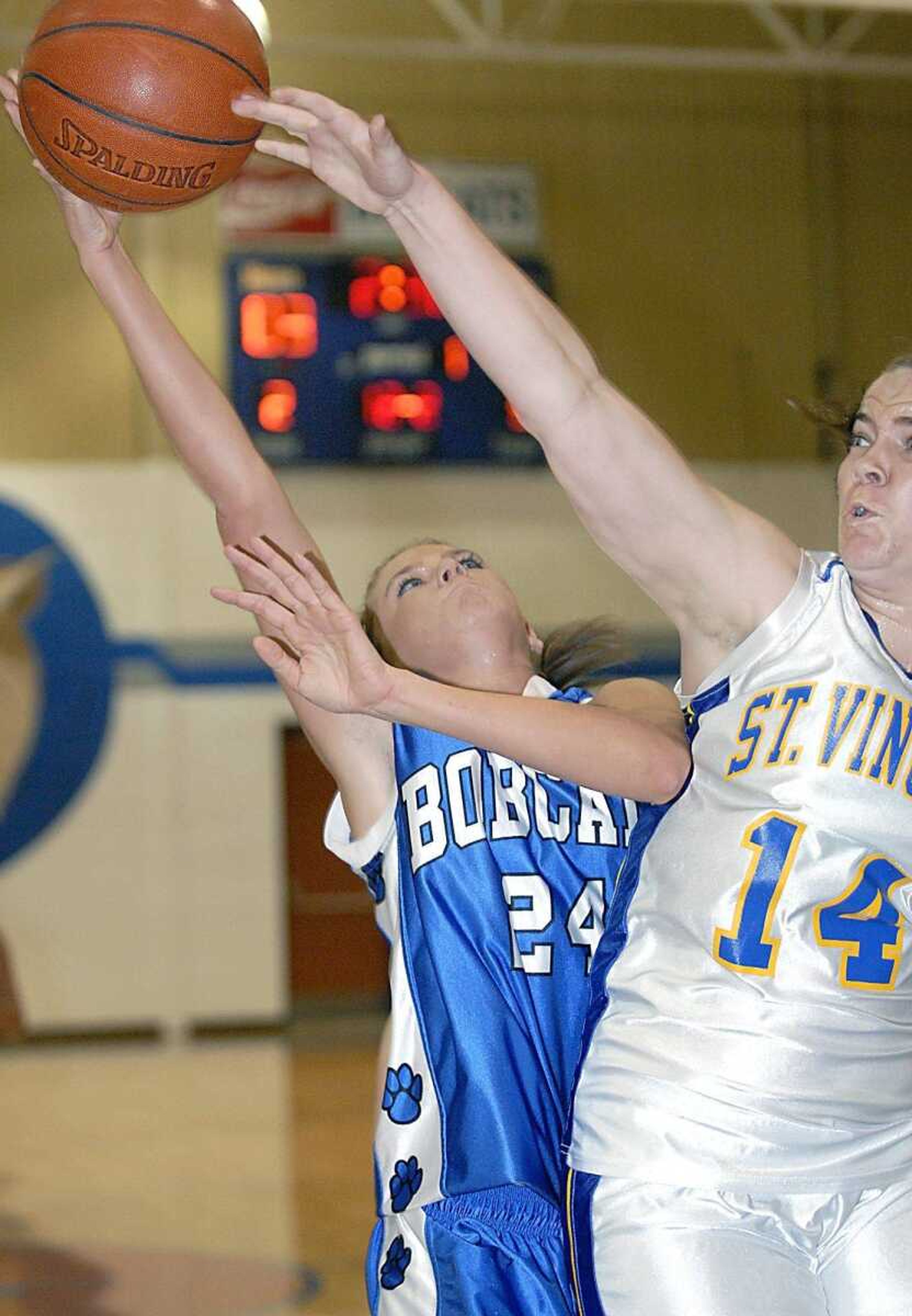 St. Vincent's Brooke Brown blocked Jodi Menz's shot during the championship game of the Delta tournament Saturday. (Kit Doyle)