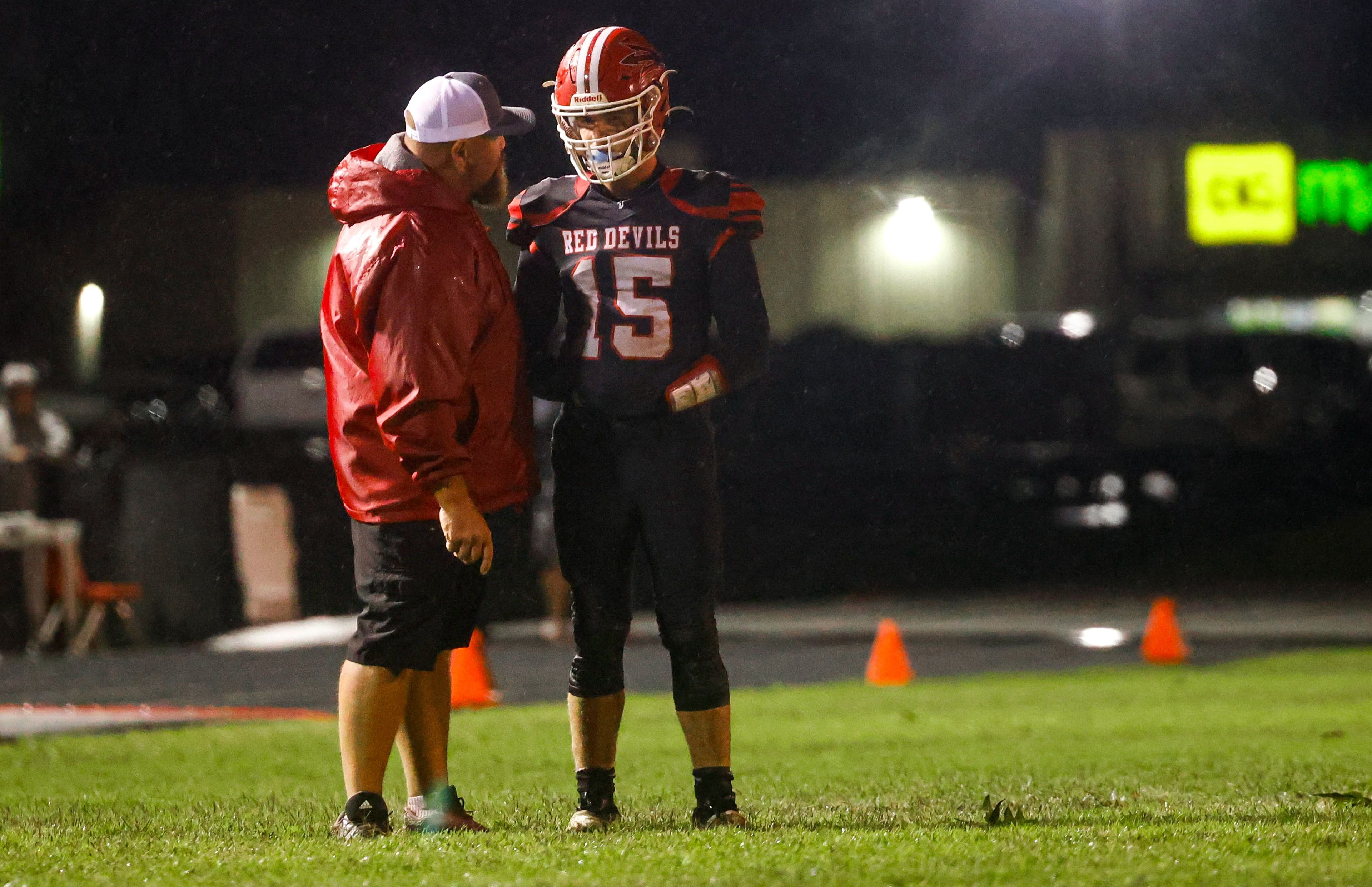 Chaffee coach Jack Altermatt talks to quarterback Leyton Hanback during a game against Principia on Sept. 26, in Chaffee. 