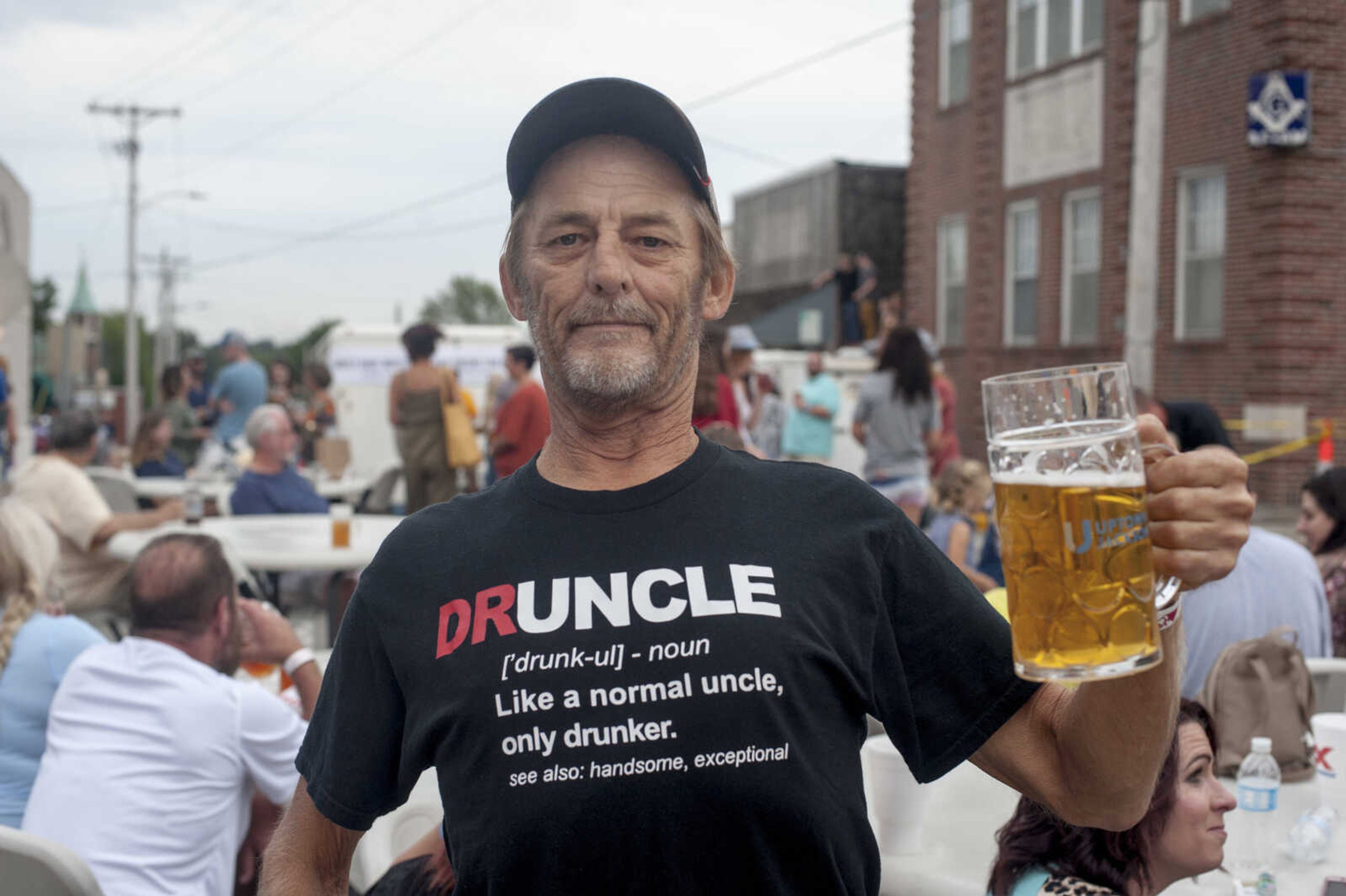 Fritz Hobeck shows off a novelty t-shirt to the camera during Uptown Jackson Oktoberfest Saturday, Oct. 5, 2019, in Uptown Jackson.