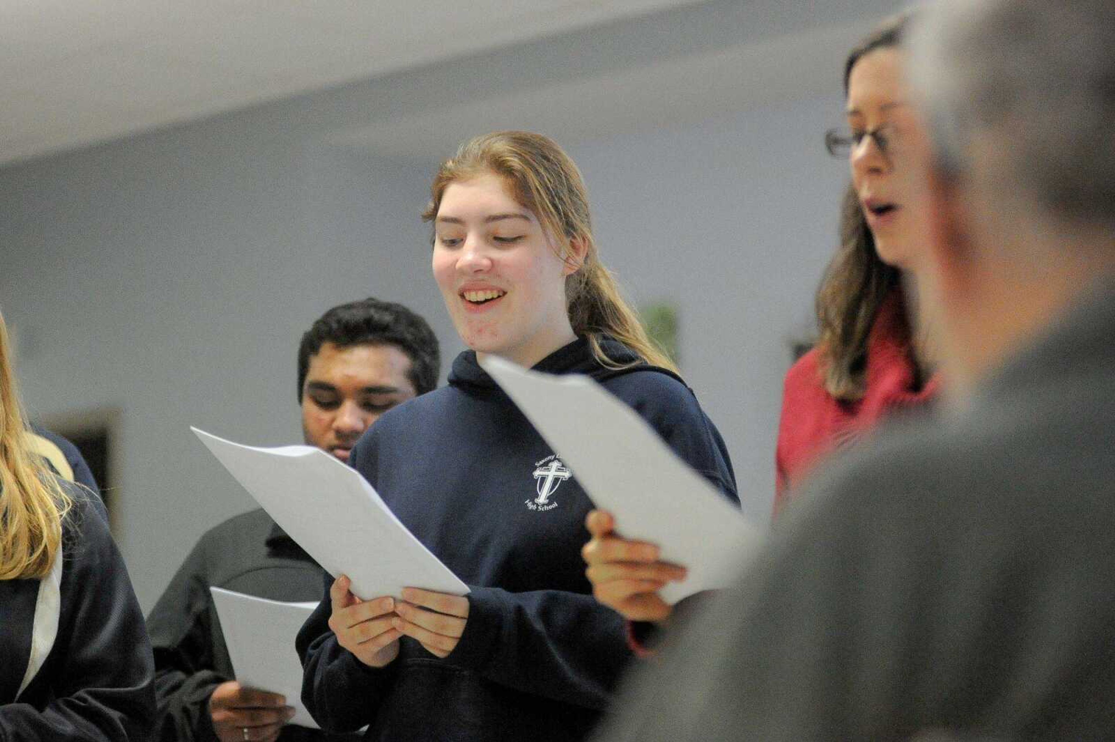 The Saxony Lutheran High School Beta Club moves through the halls of the Missouri Veterans Home as members sing Christmas carols Dec. 8 in Cape Girardeau. (Glenn Landberg)