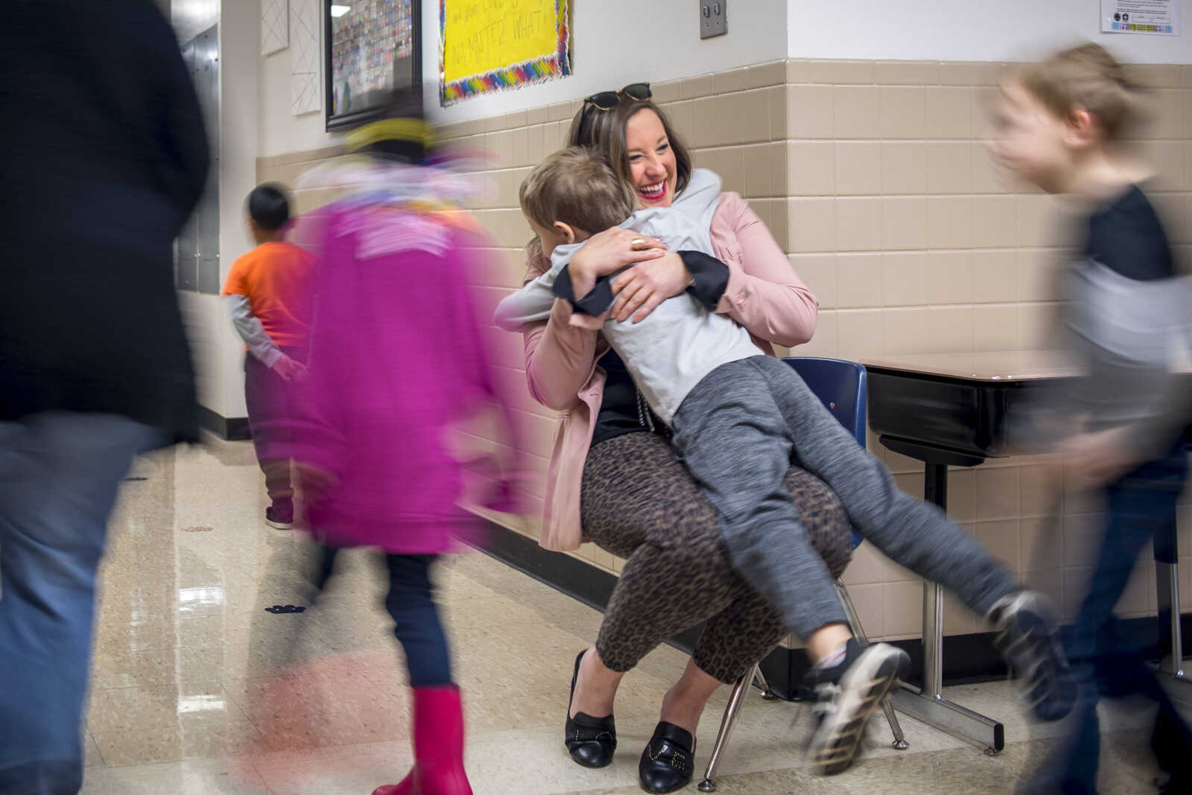 A student leaps into a hug with Jefferson Elementary Principal Leigh Ragsdale between classes Friday, Jan. 18, 2019.&nbsp;Using mindfulness techniques, STREAM curriculum and lots, lots, lots of hugs, Ragsdale and her staff are working to revitalize Jefferson, which had previously been one of the district's underperforming schools.