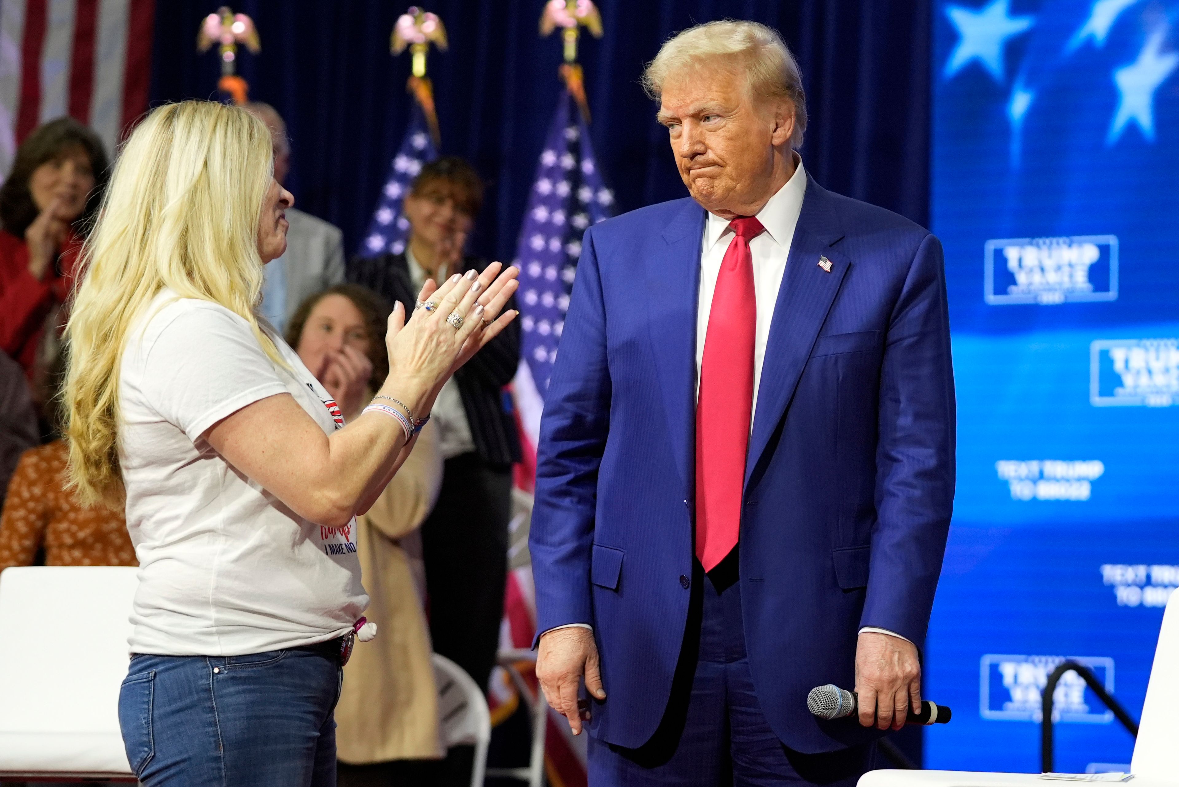 Republican presidential nominee former President Donald Trump greets people as he arrives at a campaign town hall at the Greater Philadelphia Expo Center & Fairgrounds, Monday, Oct. 14, 2024, in Oaks, Pa. (AP Photo/Alex Brandon)