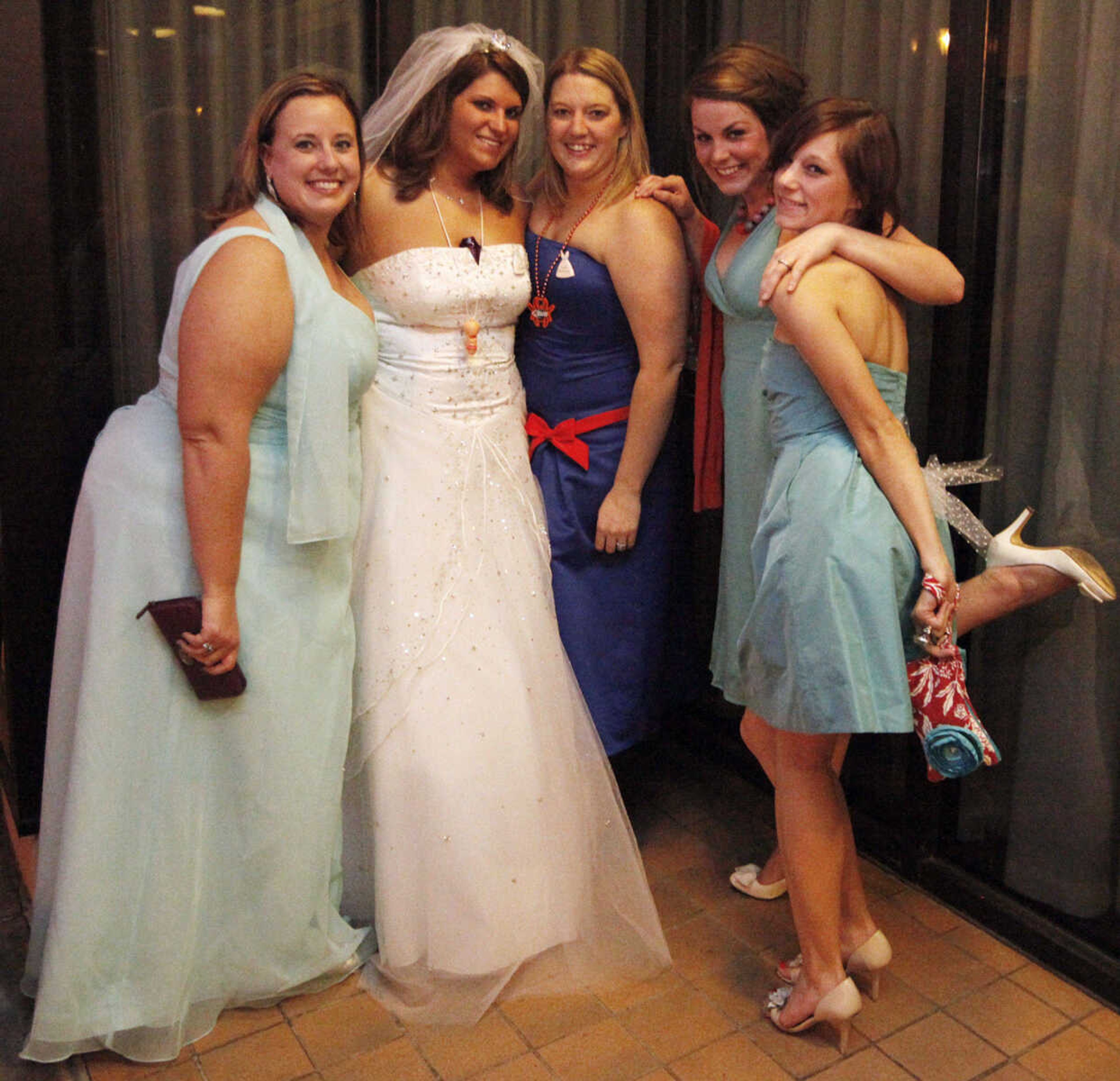 CHRIS MACKLER ~ photos@semissourian.com

A bride and her bridesmaids pose on Main Street in Cape Girardeau on Saturday, Oct. 30, 2010.