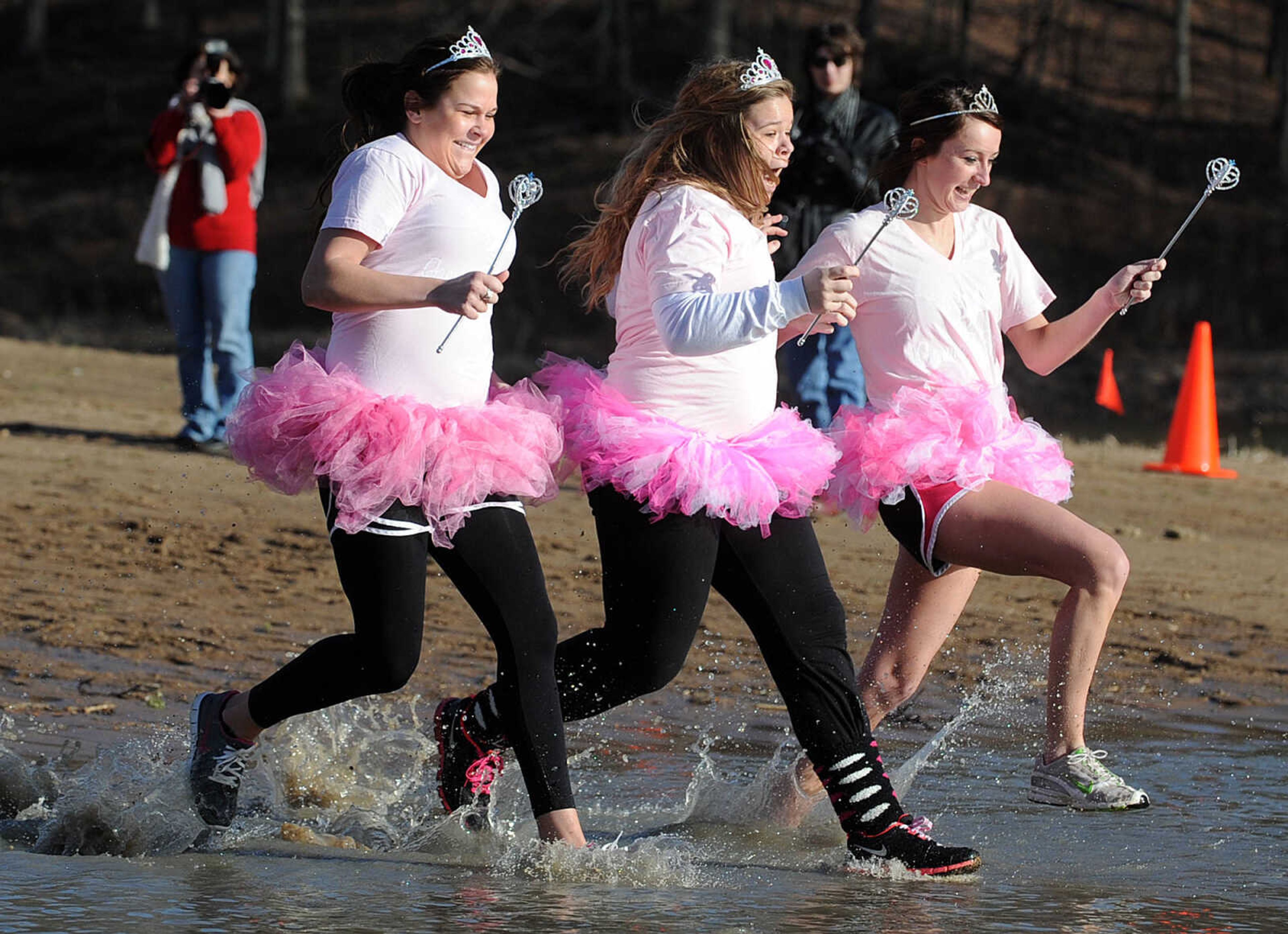 LAURA SIMON ~ lsimon@semissourian.com
People plunge into the cold waters of Lake Boutin Saturday afternoon, Feb. 2, 2013 during the Polar Plunge at Trail of Tears State Park. Thirty-six teams totaling 291 people took the annual plunge that benefits Special Olympics Missouri.