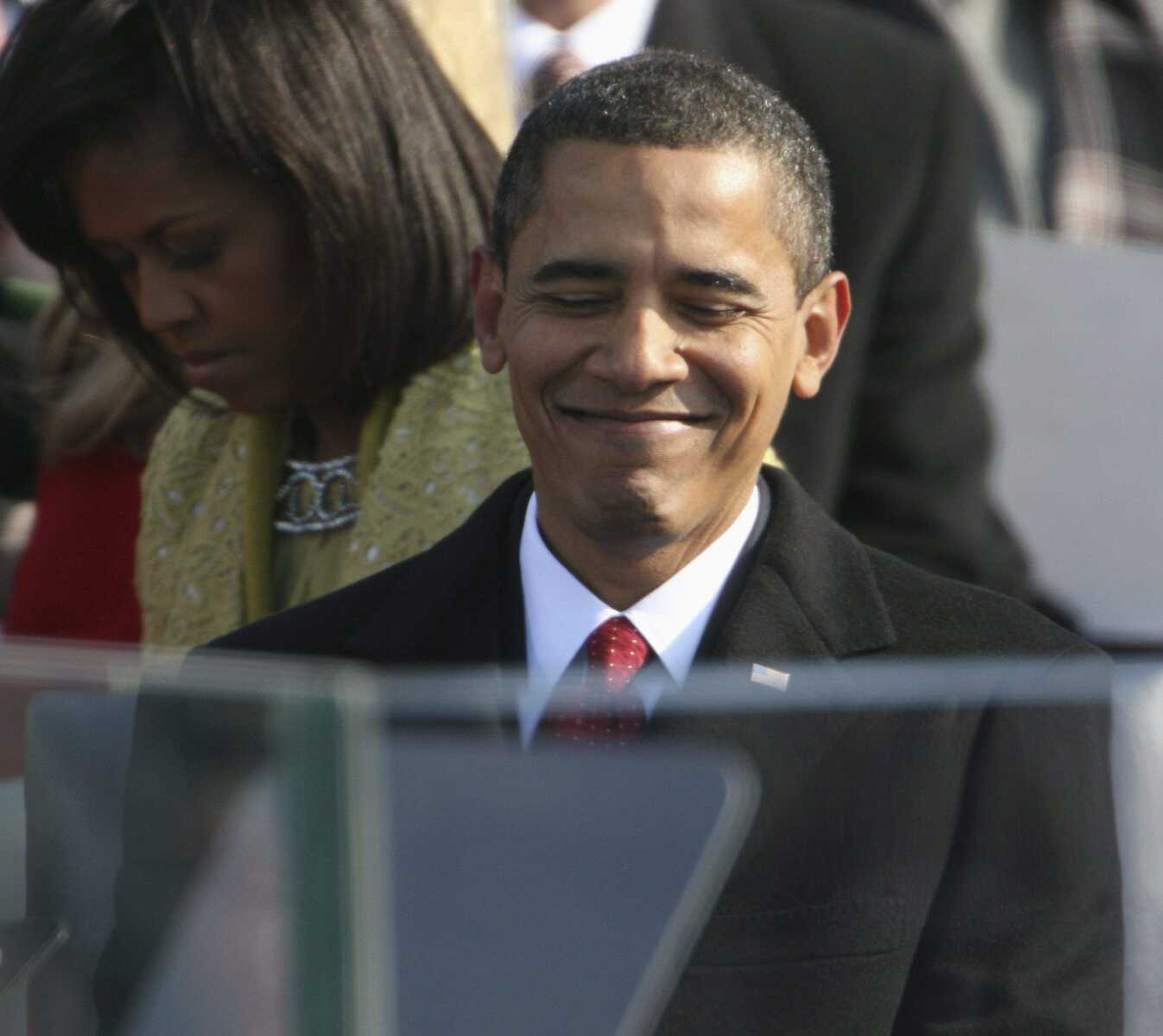 President Barack Obama smiles after being sworn in at the U.S. Capitol in Washington, Tuesday, Jan. 20, 2009. (AP Photo/Ron Edmonds)