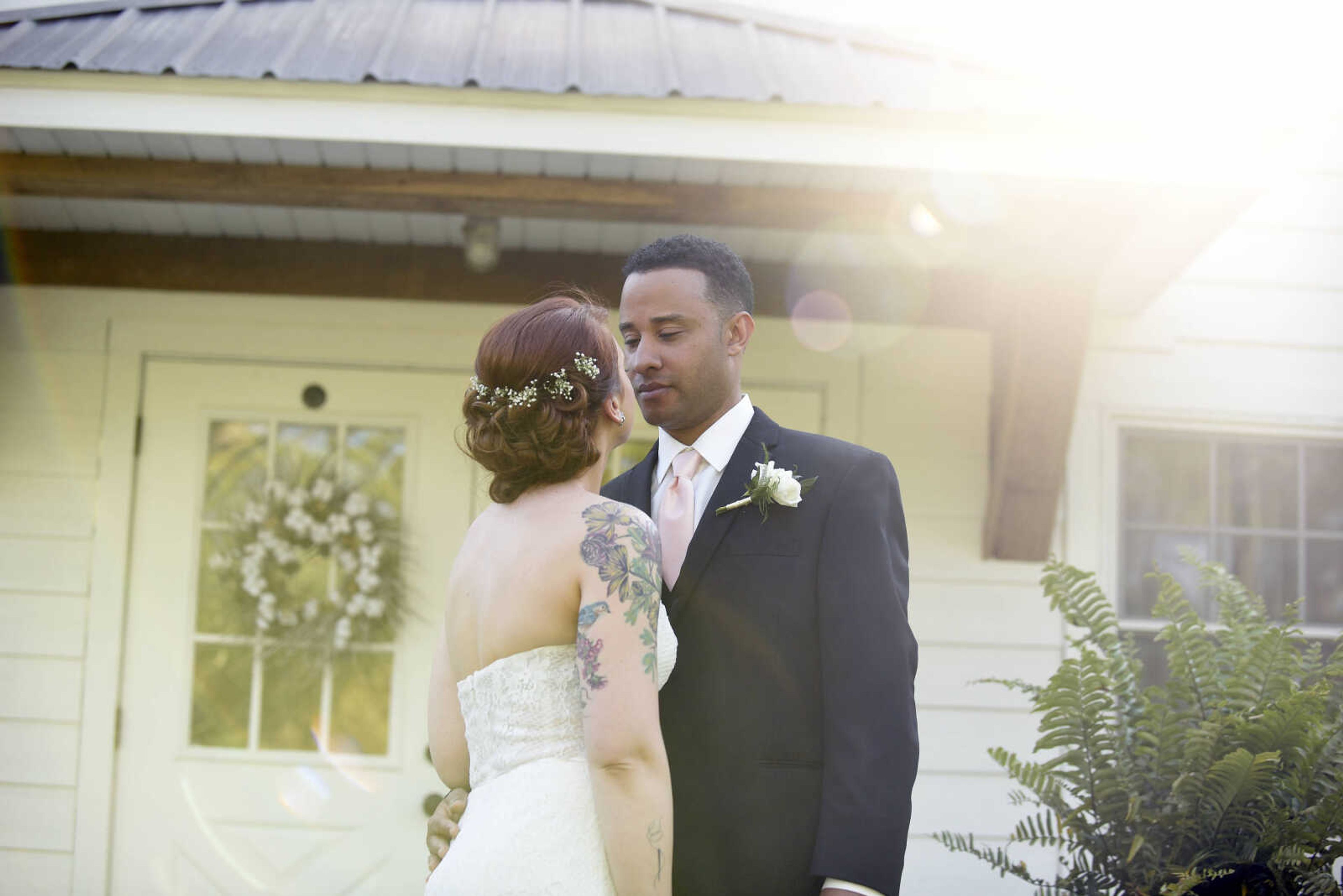 Alvina Valenta: Style 9656 
Ivory lace trumpet bridal gown with a strapless neckline and sheer lace back. Available at Magnolias Bridal Boutique in Cape Girardeau.

Earrings: Lindsay Marie Design : Style "Magnolia"


Wedding suits courtesy of Jim's Formal Wear and available at Garber's Men's Wear in Cape Girardeau.