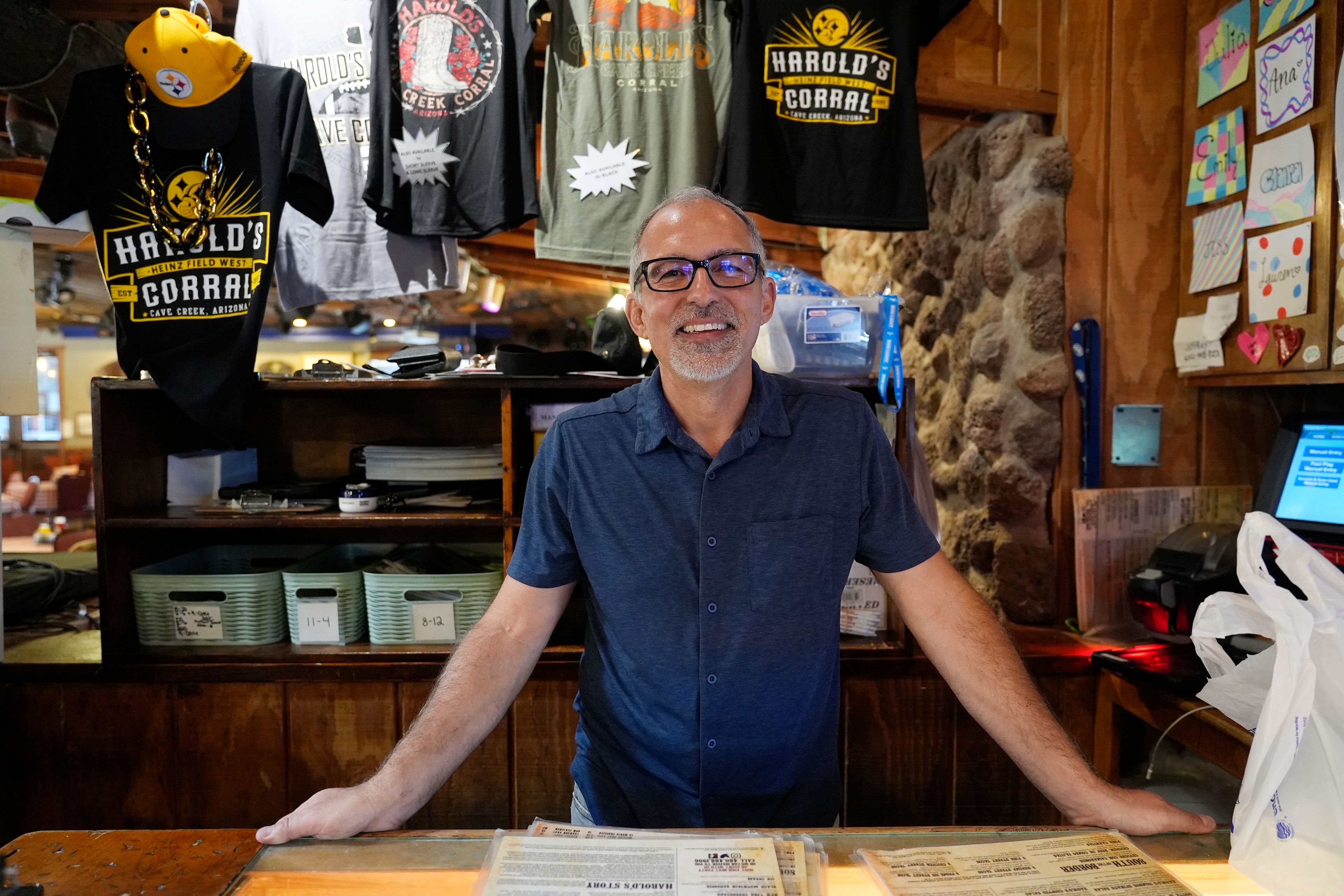 Dan Piacquadio, owner of Harold's Cave Creek Corral, stands at the front register as he is awaiting the results regarding Arizona Prop 138 on minimum wage Thursday, Oct. 3, 2024, in Cave Creek, Ariz. (AP Photo/Ross D. Franklin)