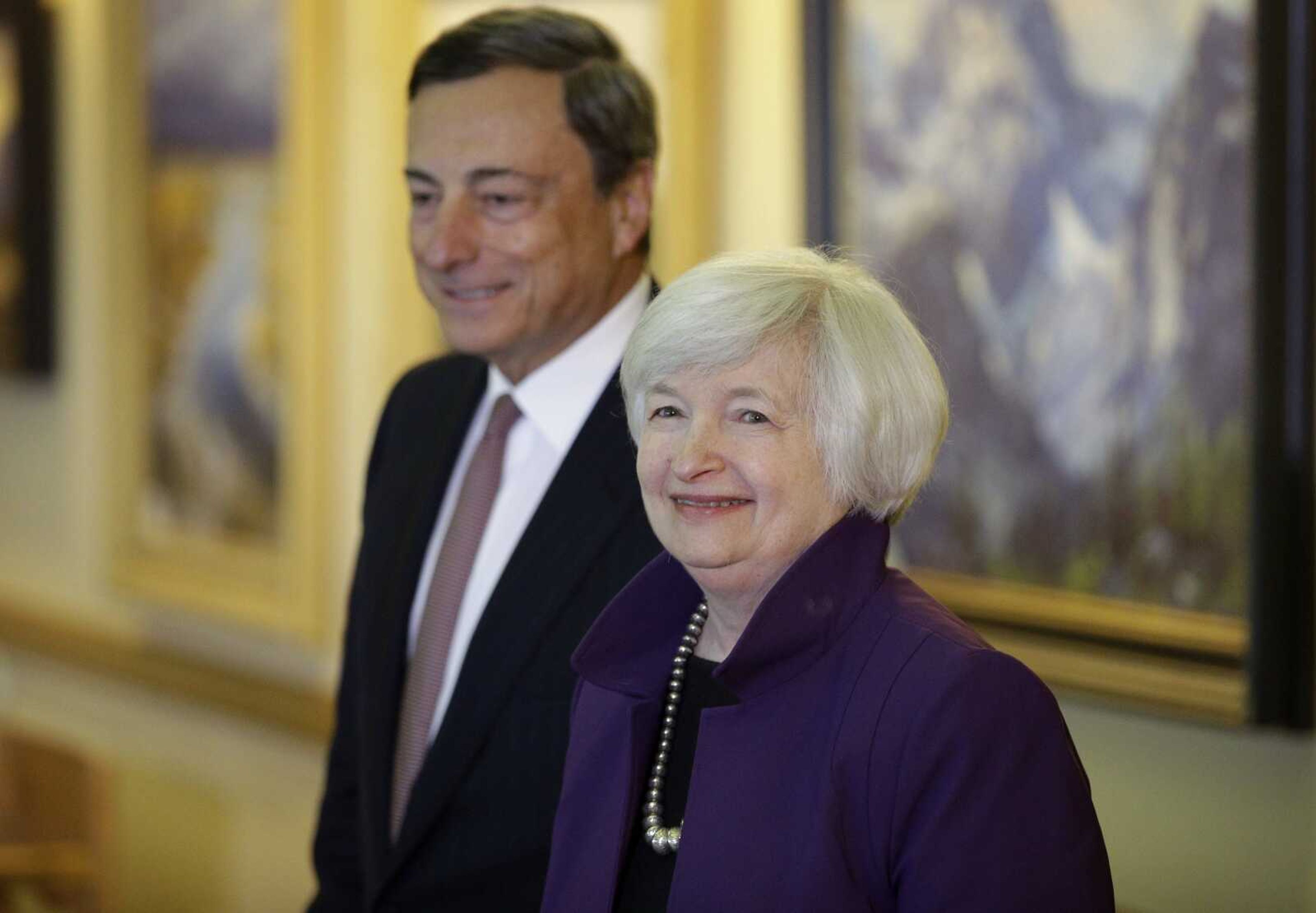 Federal Reserve Chair Janet Yellen, right, and European Central Bank President Mario Draghi walk together during the 2014 Jackson Hole Economic Policy Symposium at the Jackson Lake Lodge in Grand Teton National Park near Jackson, Wyoming. Yellen and Draghi gave high-profile speeches Friday from the annual meeting of central bankers in Jackson Hole.