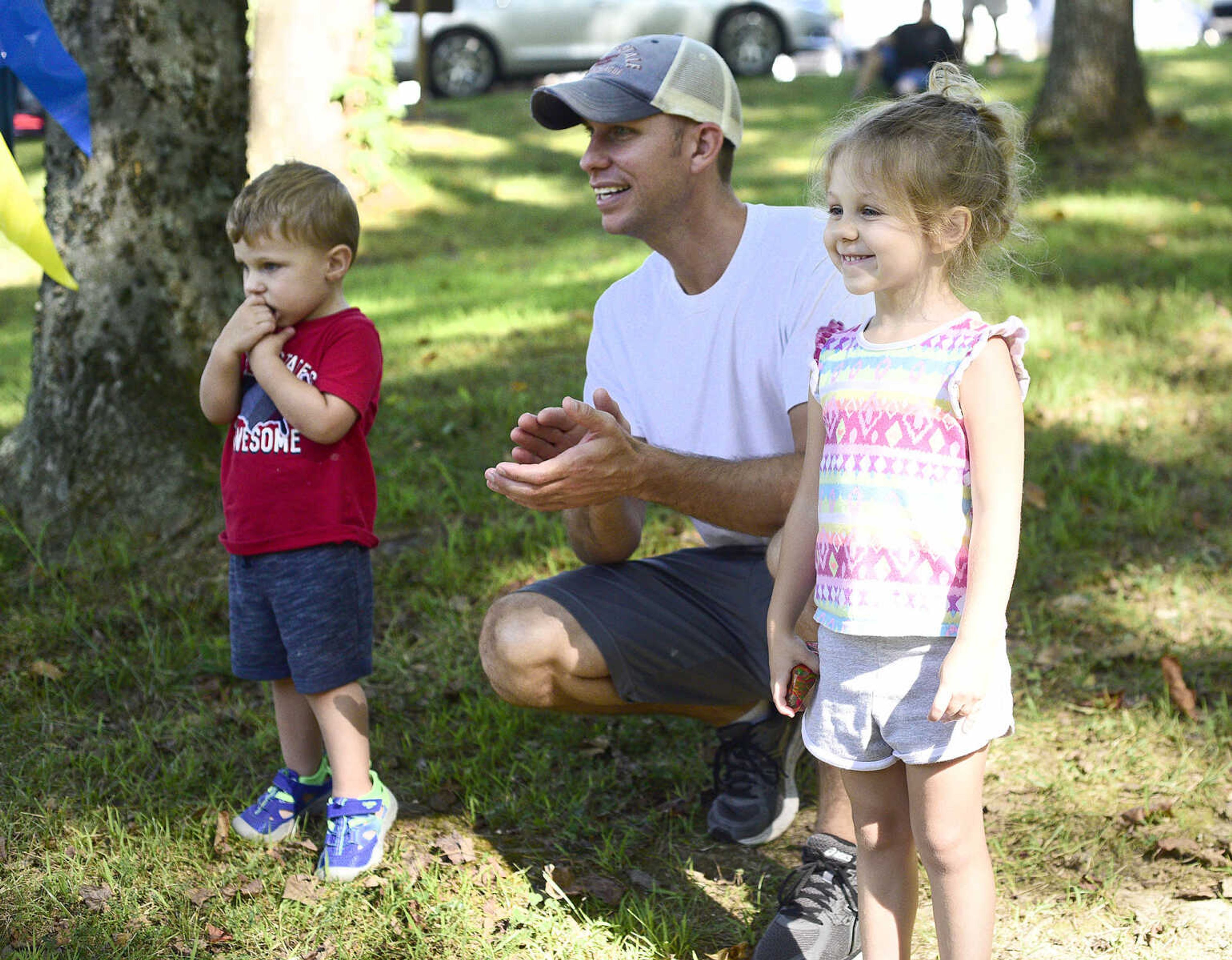 Kora and Kase O'Loughlin cheer on their mom alongside their father Matthew during the first ever St. Jude Heroes Yak 'n Run on Saturday, Aug. 26, 2017, at Trail of Tears State Park. All proceeds from the event support St. Jude Children's Research Hospital