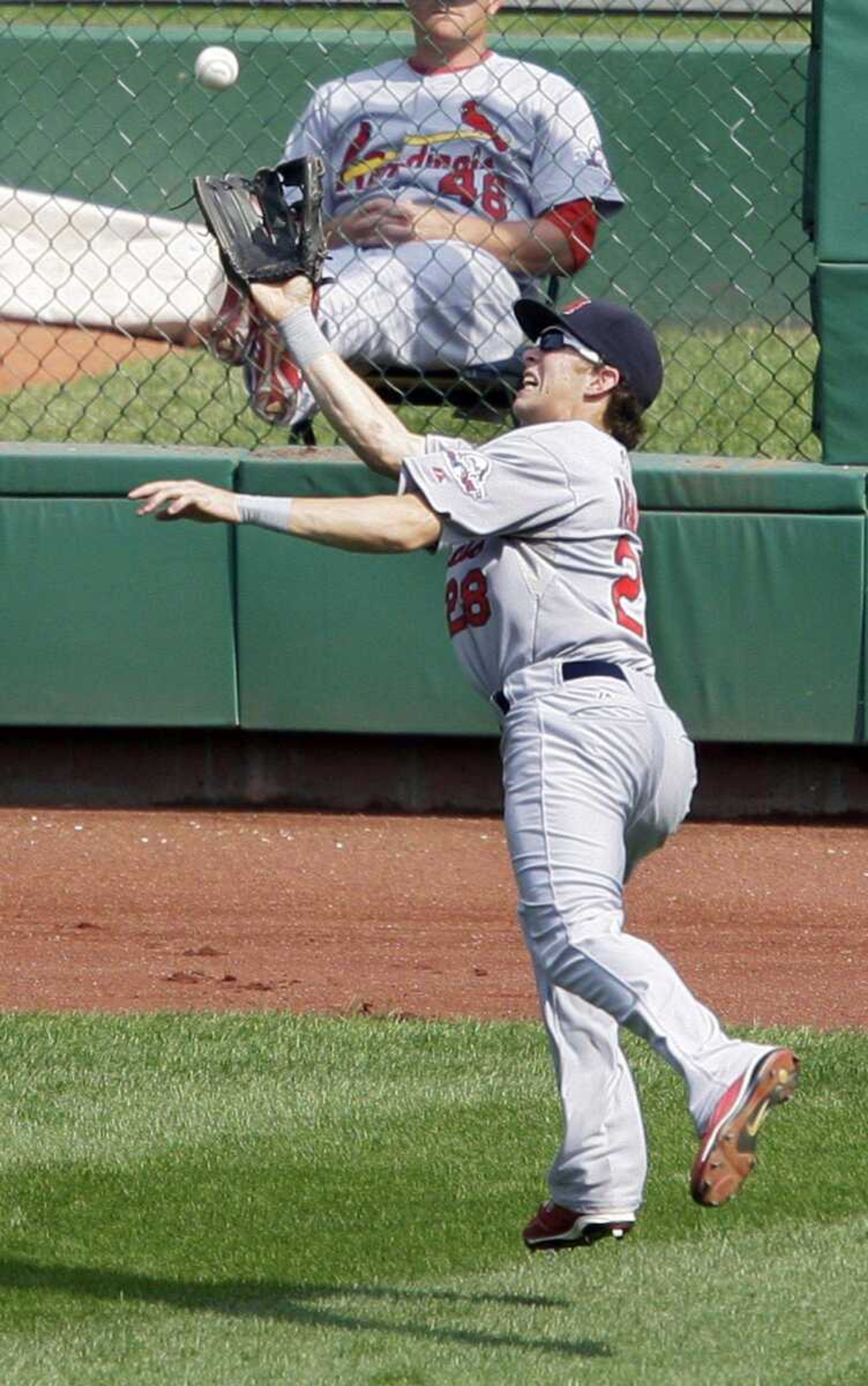 Cardinals center fielder Colby Rasmus leaps to make the catch on a ball during a game against the Pirates last season. (GENE PUSKAR ~ Associated Press)