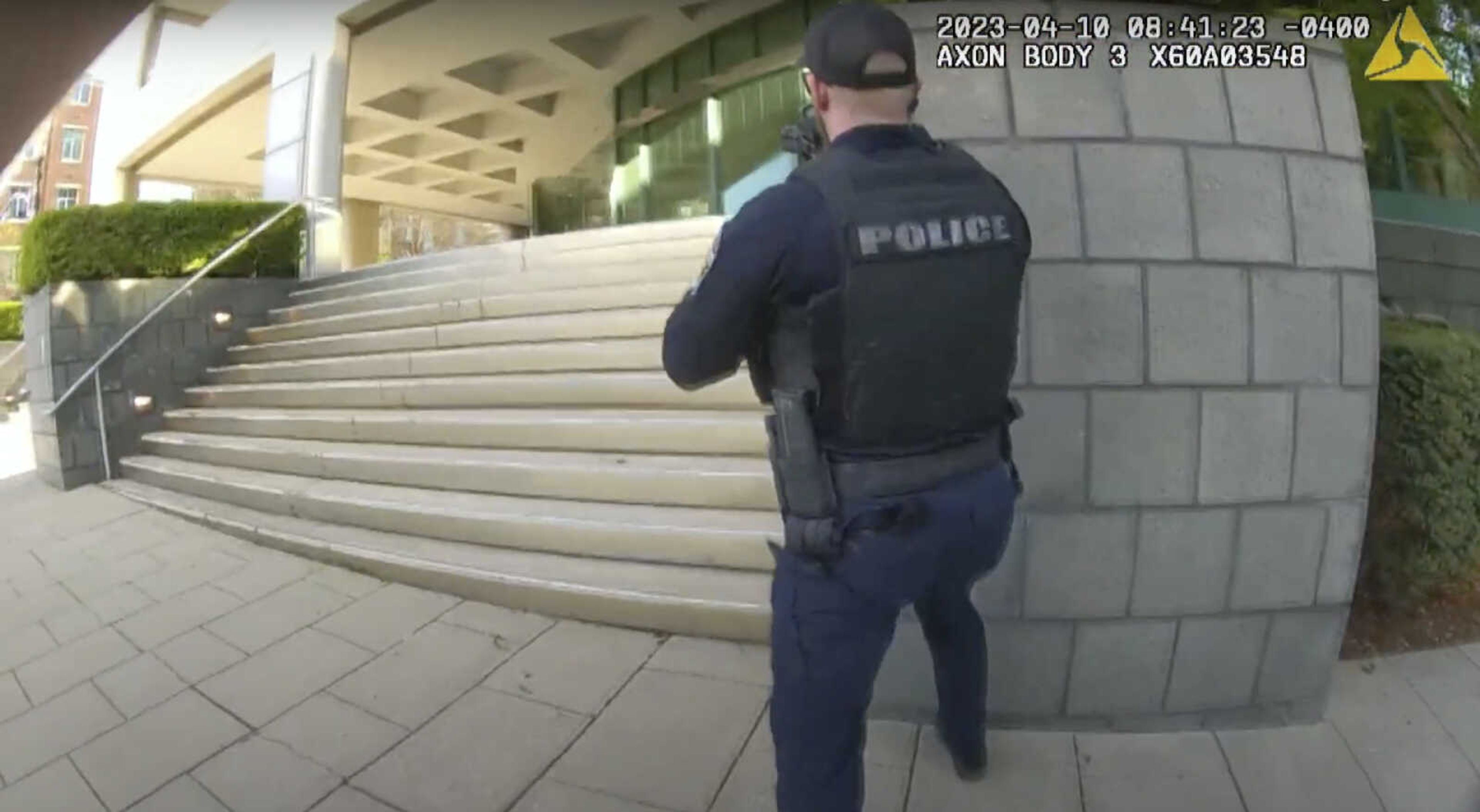 In this screen grab taken from the body cam video of officer Nickolas Wilt, fellow officer Cory Galloway approaches an active shooting situation, with Wilt following behind him, Monday at Old National Bank in Louisville, Kentucky.